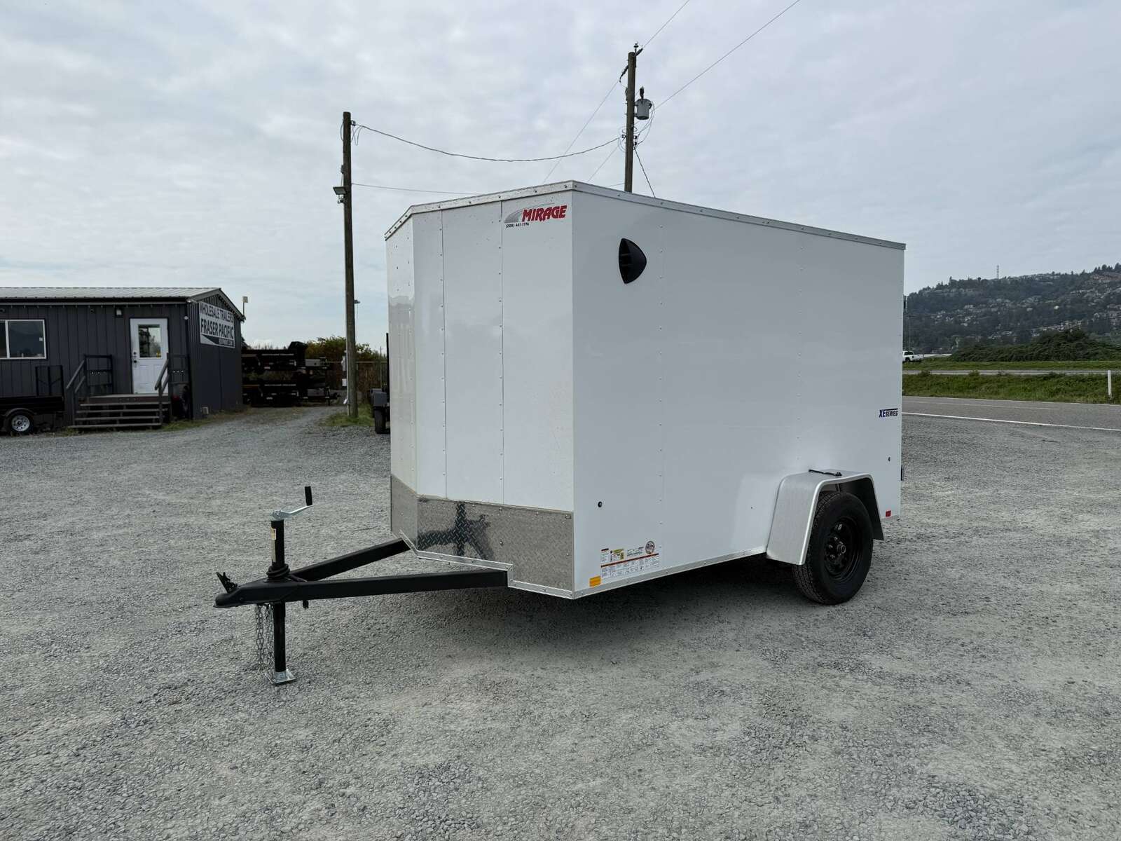 Photo of 2026 Mirage XE 6x10 Enclosed Cargo Trailer V Nose Barn Doors White Standard Height 2990lb GVW