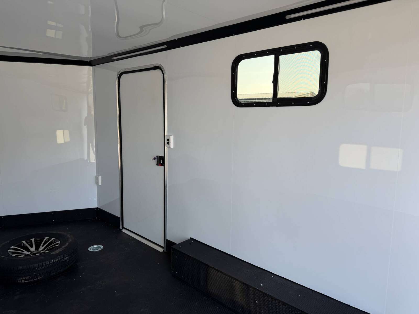 Photo of 2026 Royal 8.5x16 V Nose Cargo Enclosed Trailer Camping Package Blue w/ Blackout Pkg, Insulated, Ramp Door, White Walls, 2x Windows & More!