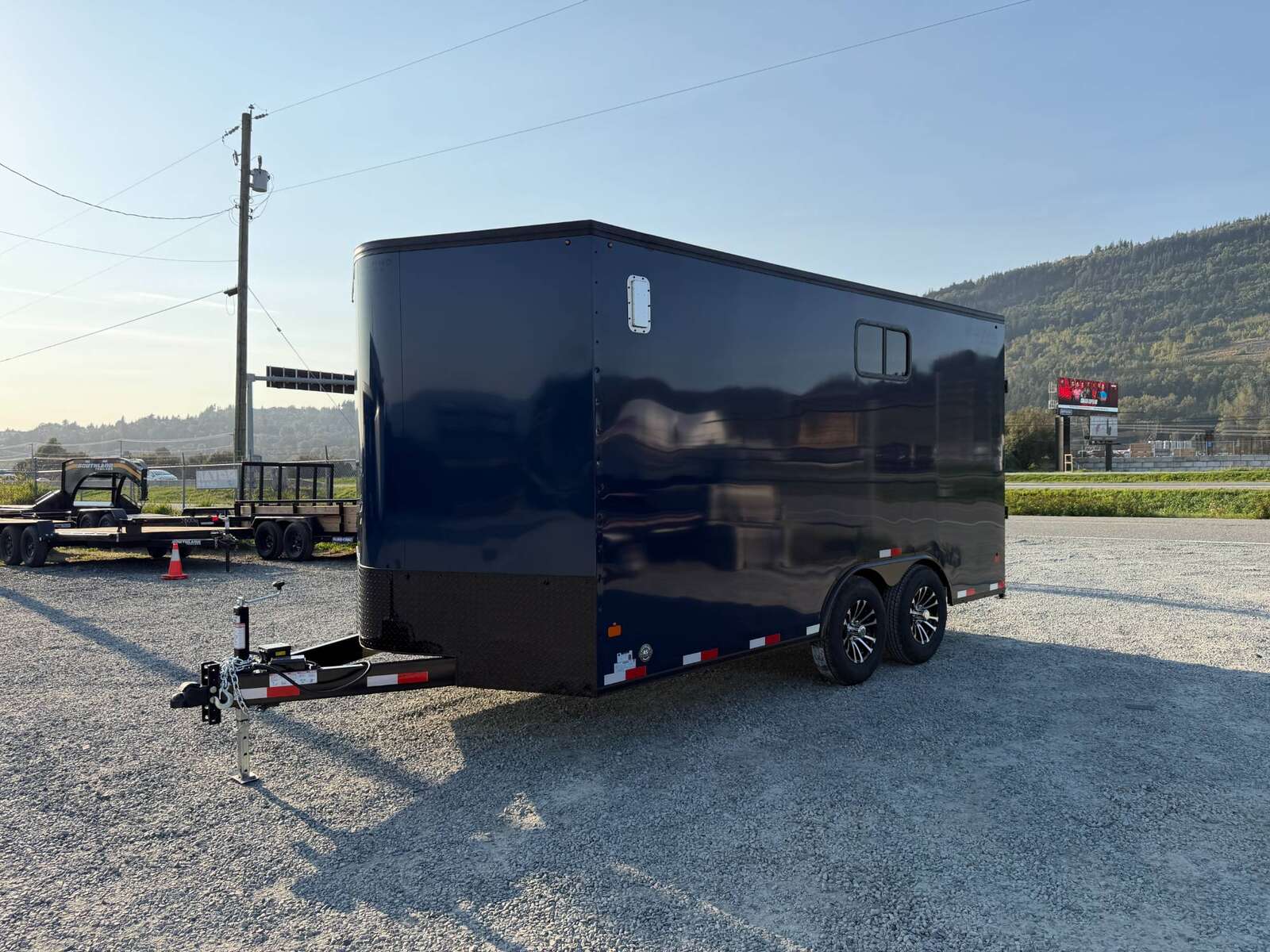 Photo of 2026 Royal 8.5x16 V Nose Cargo Enclosed Trailer Camping Package Blue w/ Blackout Pkg, Insulated, Ramp Door, White Walls, 2x Windows & More!
