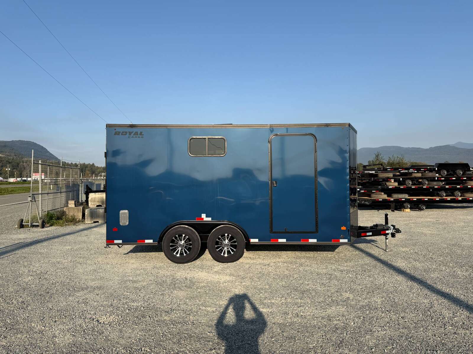 Photo of 2026 Royal 8.5x16 V Nose Cargo Enclosed Trailer Camping Package Blue w/ Blackout Pkg, Insulated, Ramp Door, White Walls, 2x Windows & More!