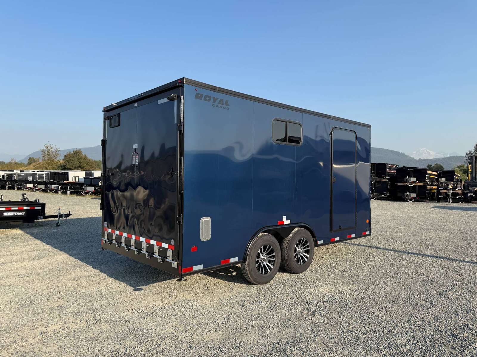 Photo of 2026 Royal 8.5x16 V Nose Cargo Enclosed Trailer Camping Package Blue w/ Blackout Pkg, Insulated, Ramp Door, White Walls, 2x Windows & More!
