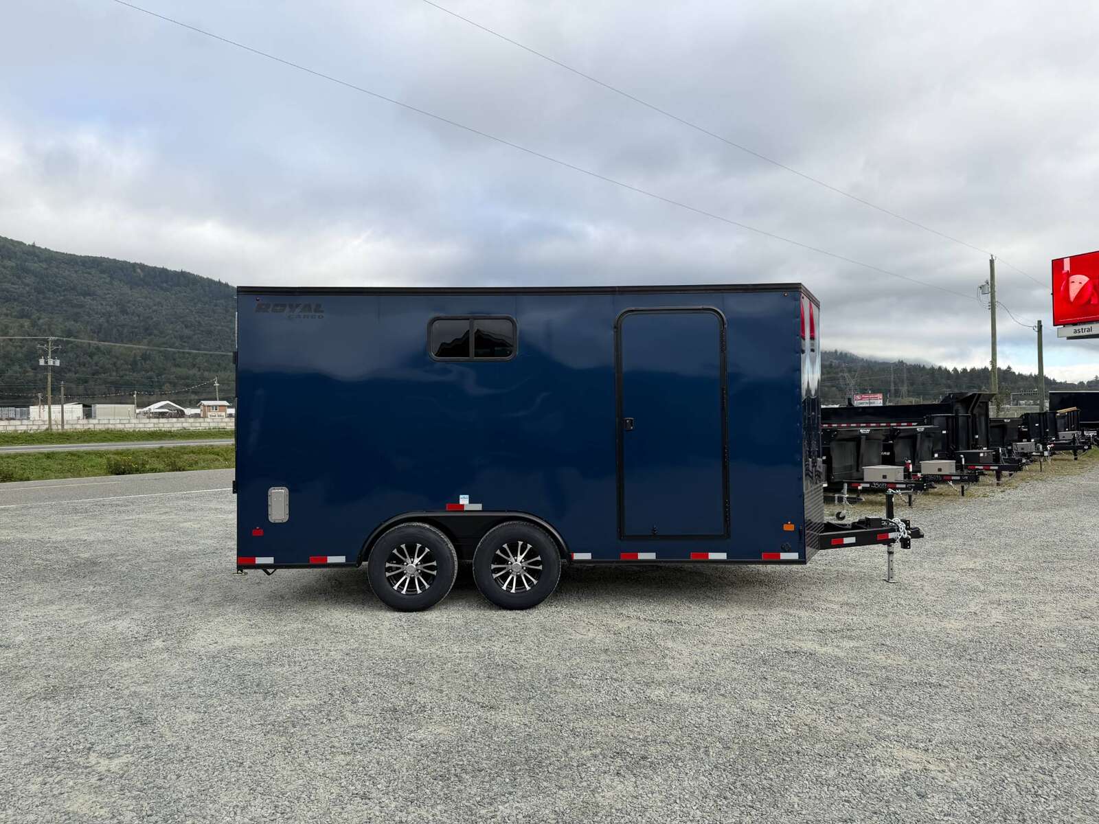 Photo of 2026 Royal 8.5x16 V Nose Cargo Enclosed Trailer Camping Package Blue w/ Blackout Pkg, Insulated, Ramp Door, White Walls, 2x Windows & More!