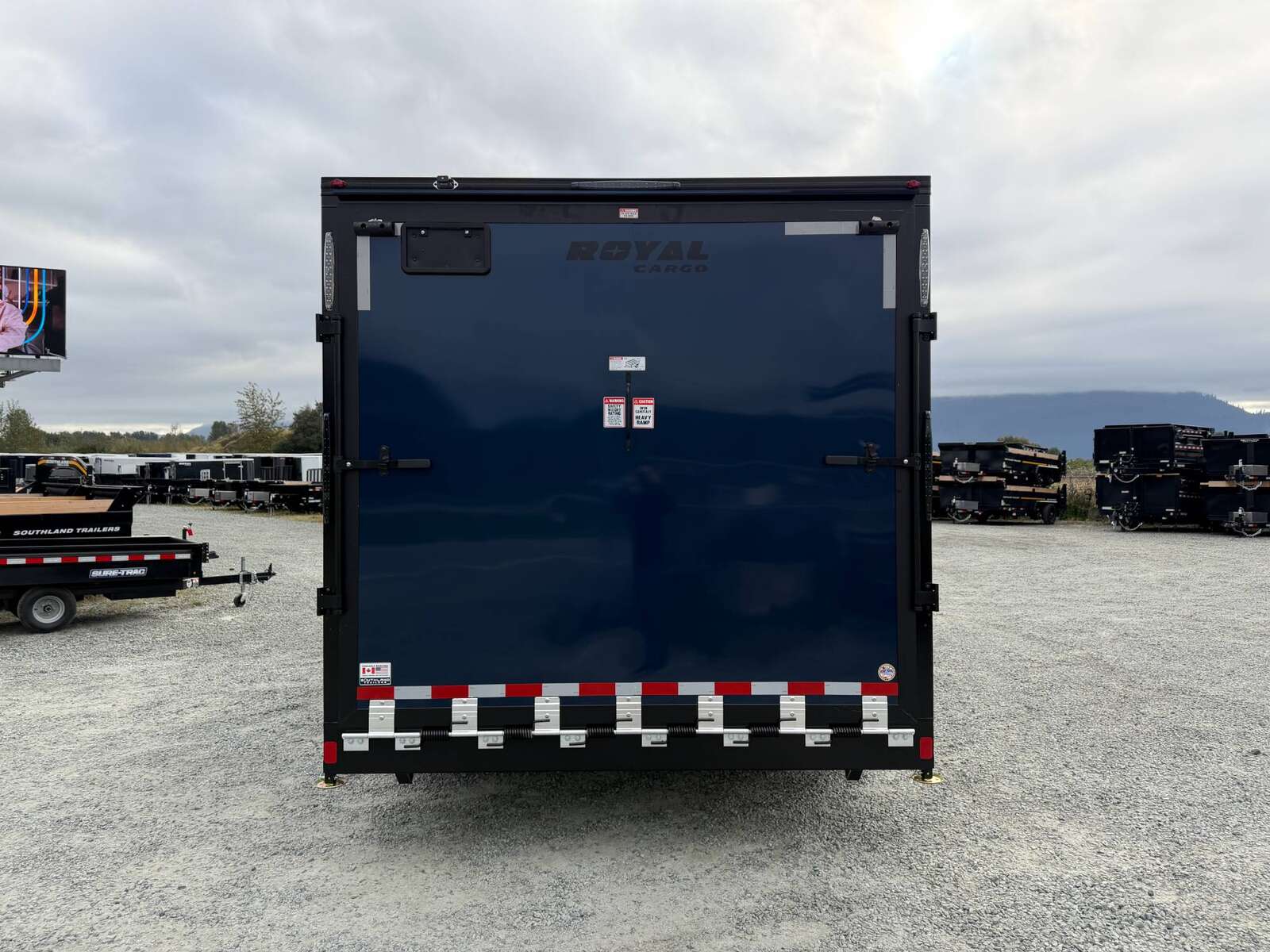 Photo of 2026 Royal 8.5x16 V Nose Cargo Enclosed Trailer Camping Package Blue w/ Blackout Pkg, Insulated, Ramp Door, White Walls, 2x Windows & More!