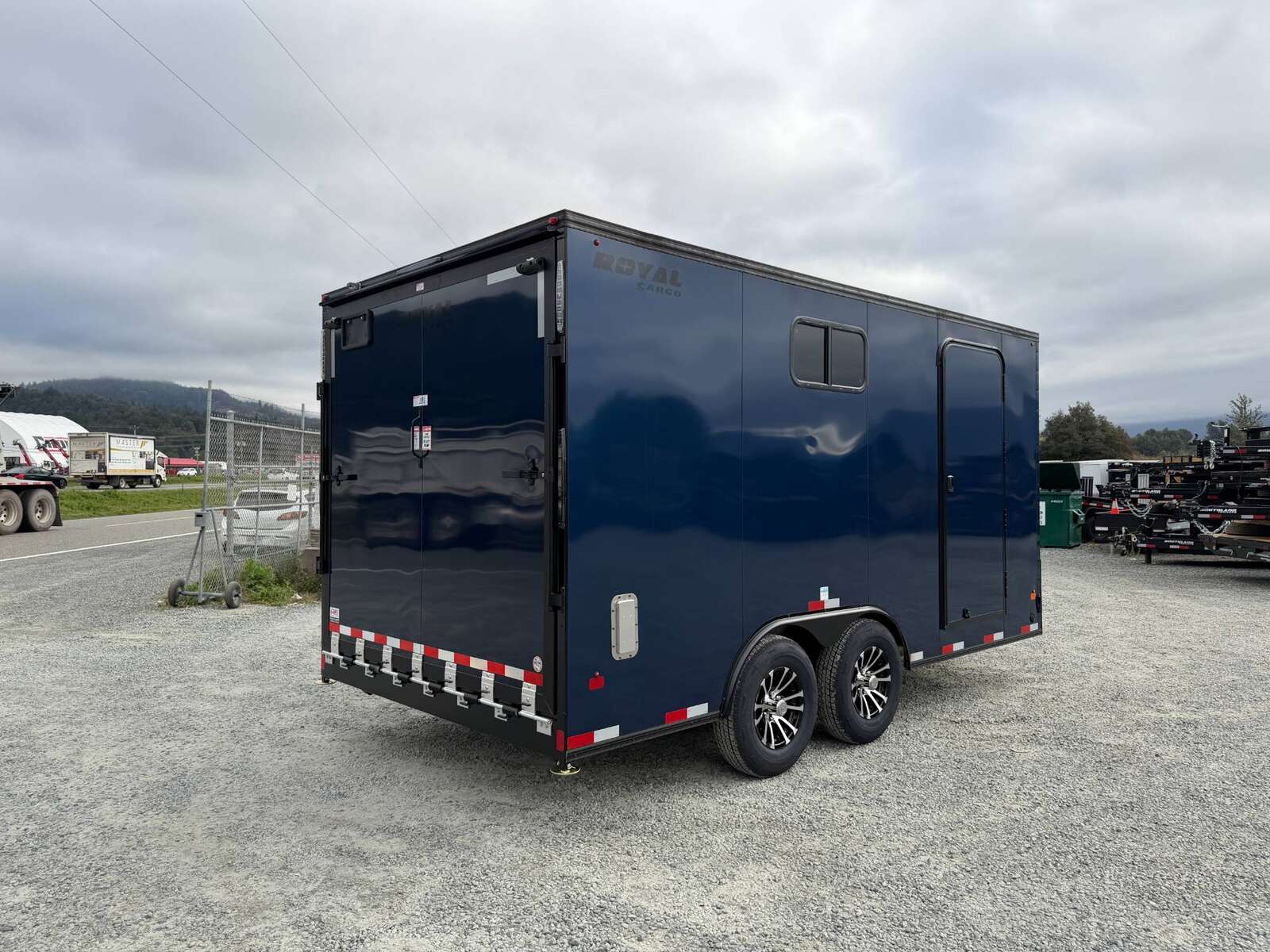 Photo of 2026 Royal 8.5x16 V Nose Cargo Enclosed Trailer Camping Package Blue w/ Blackout Pkg, Insulated, Ramp Door, White Walls, 2x Windows & More!