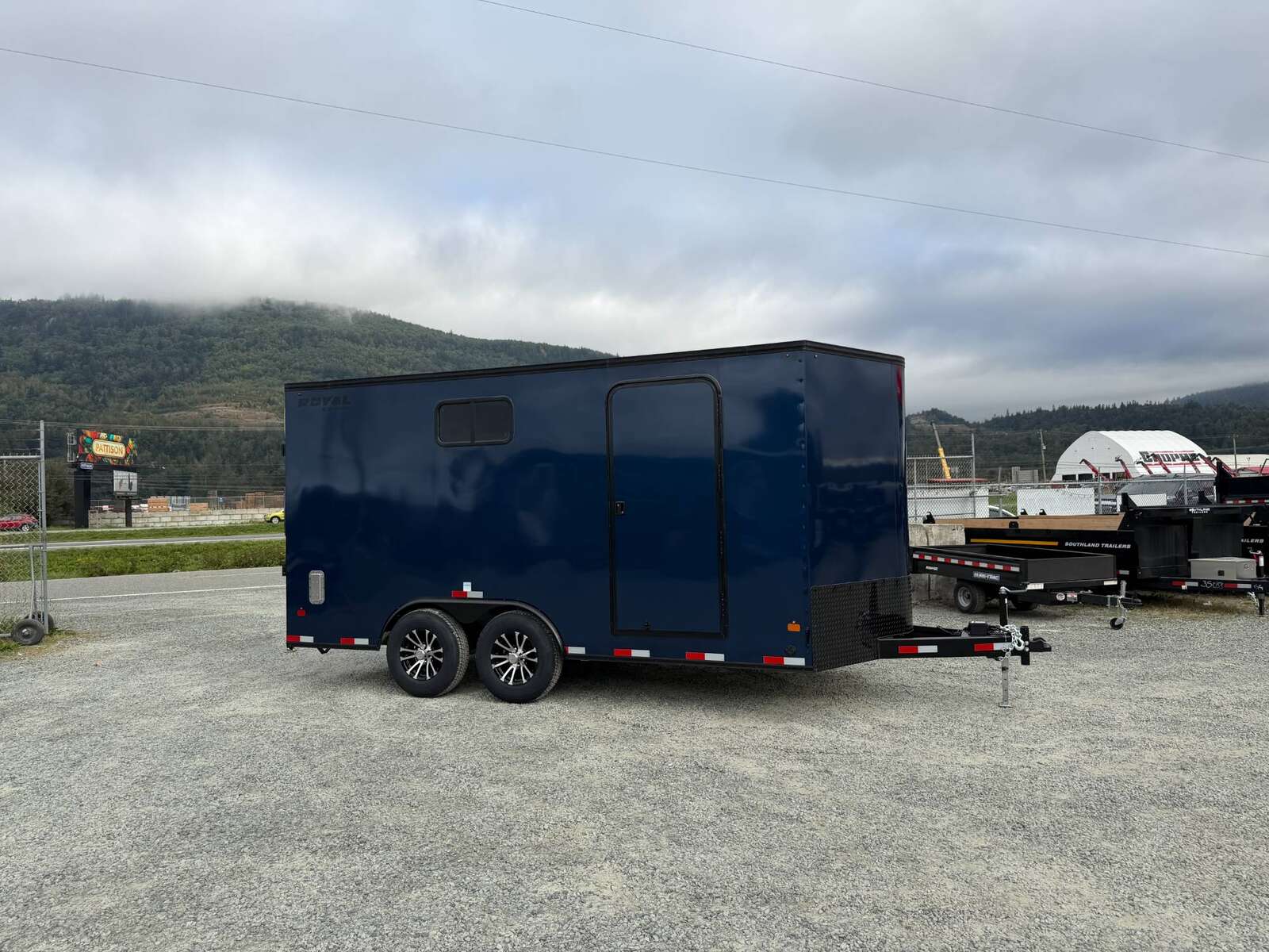 Photo of 2026 Royal 8.5x16 V Nose Cargo Enclosed Trailer Camping Package Blue w/ Blackout Pkg, Insulated, Ramp Door, White Walls, 2x Windows & More!