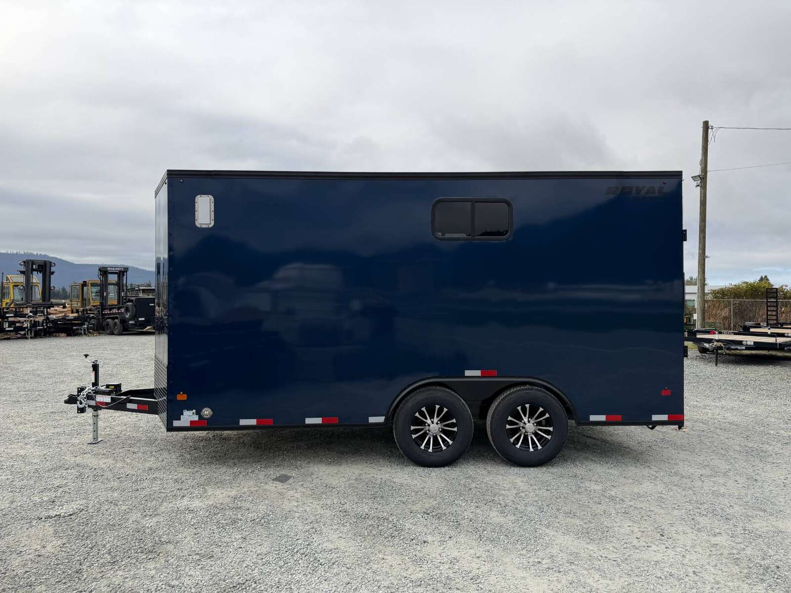 Photo of 2026 Royal 8.5x16 V Nose Cargo Enclosed Trailer Camping Package Blue w/ Blackout Pkg, Insulated, Ramp Door, White Walls, 2x Windows & More!