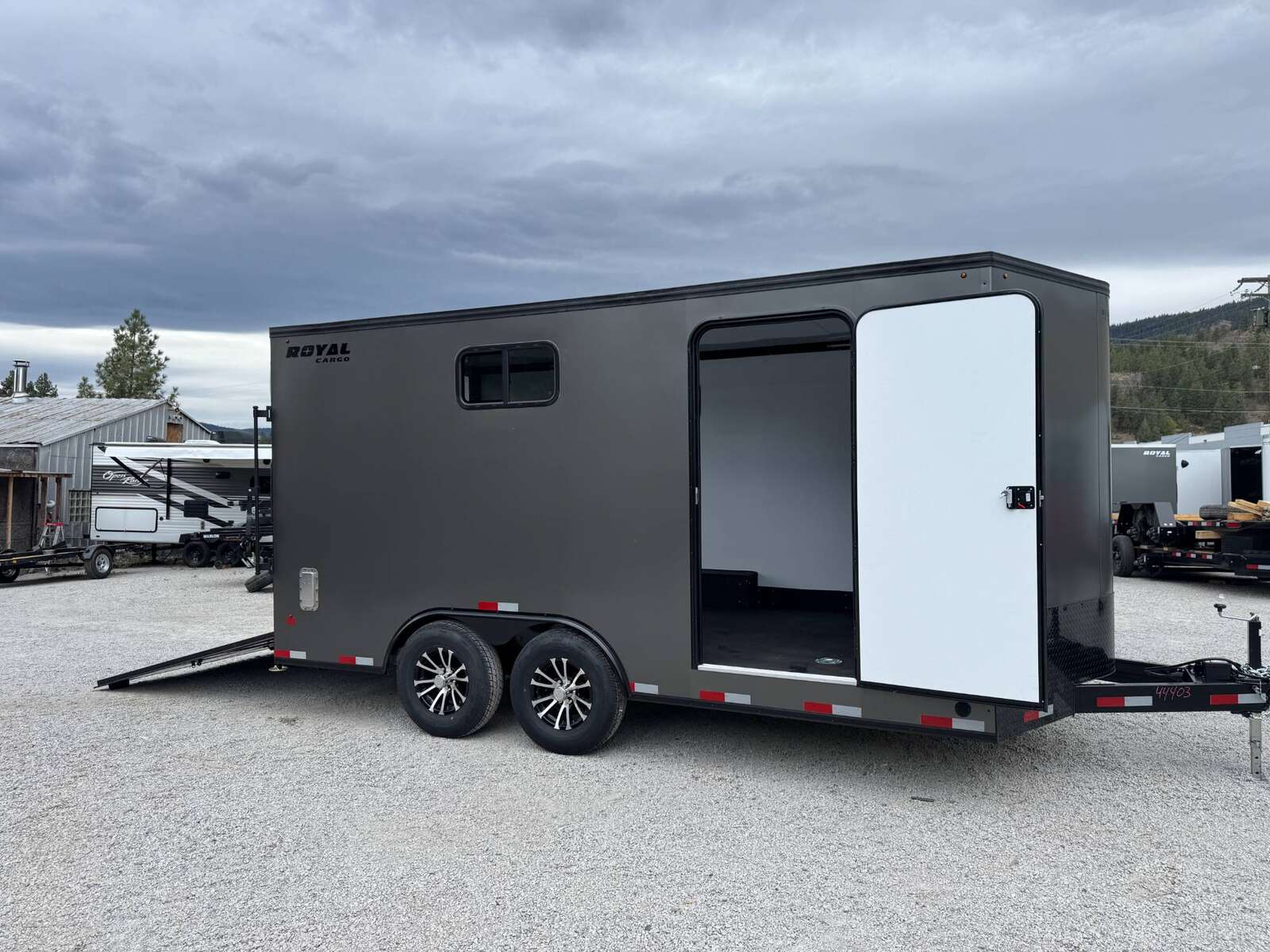 Photo of 2026 Royal 8.5x16 V Nose Cargo Enclosed Trailer Camping Package Charcoal Grey w/ Blackout Pkg, Insulated, Ramp Door, White Walls, 2x Windows & More!