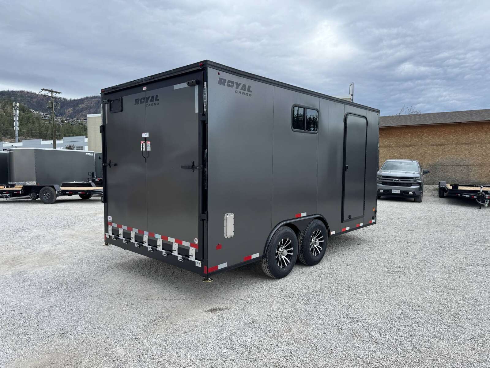 Photo of 2026 Royal 8.5x16 V Nose Cargo Enclosed Trailer Camping Package Charcoal Grey w/ Blackout Pkg, Insulated, Ramp Door, White Walls, 2x Windows & More!