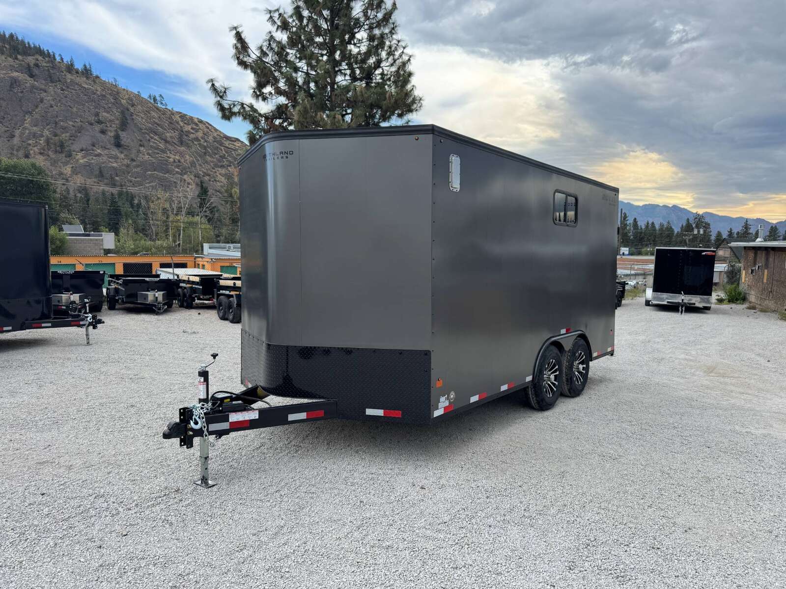 Photo of 2026 Royal 8.5x16 V Nose Cargo Enclosed Trailer Camping Package Charcoal Grey w/ Blackout Pkg, Insulated, Ramp Door, White Walls, 2x Windows & More!