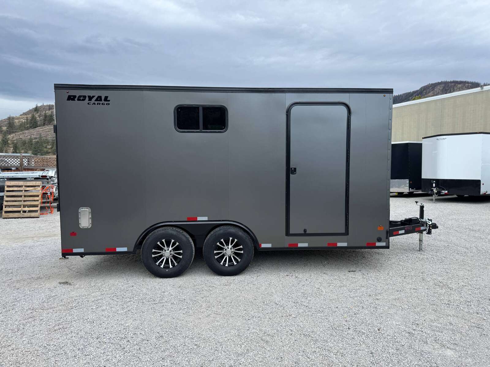 Photo of 2026 Royal 8.5x16 V Nose Cargo Enclosed Trailer Camping Package Charcoal Grey w/ Blackout Pkg, Insulated, Ramp Door, White Walls, 2x Windows & More!