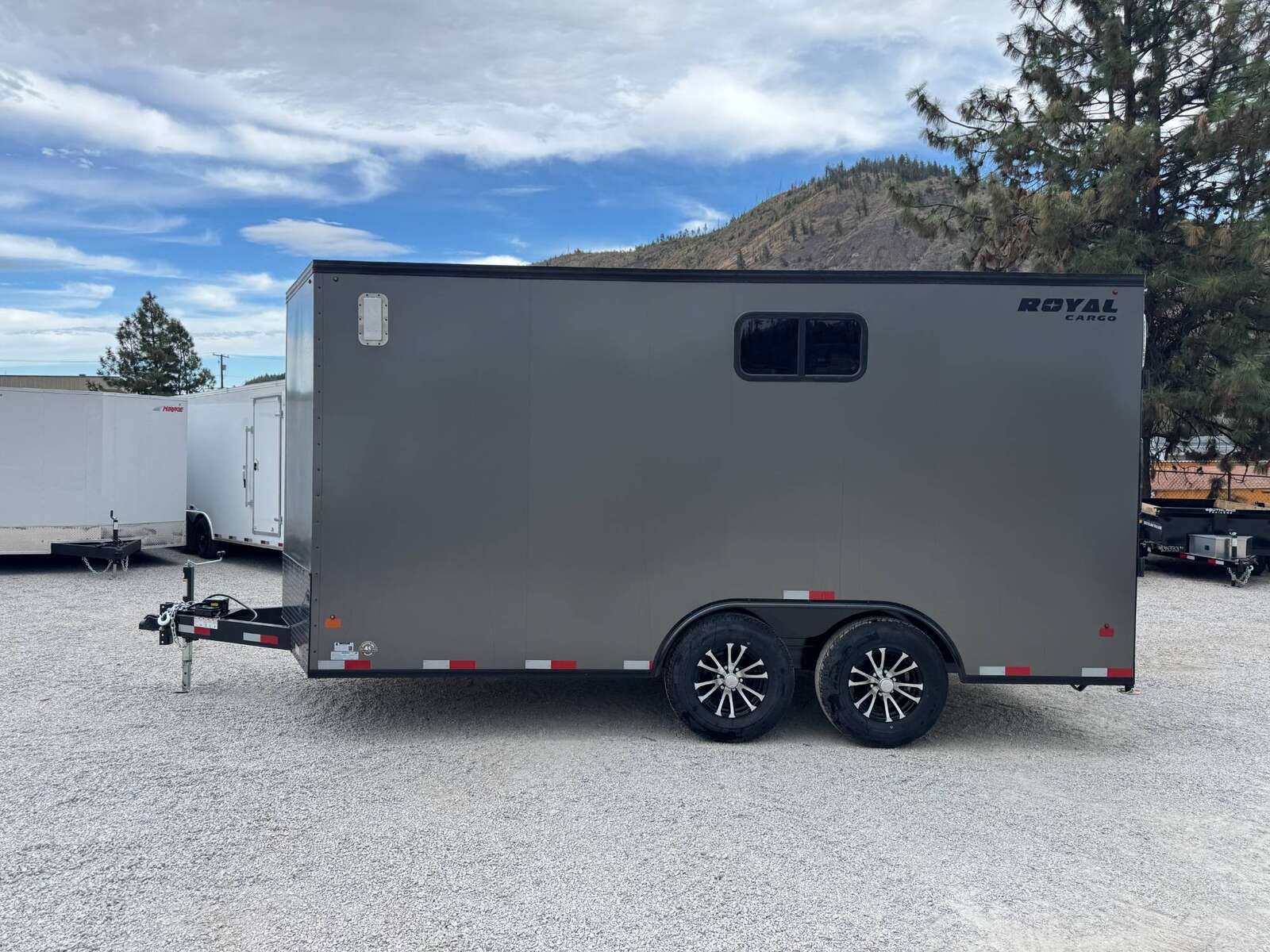 Photo of 2026 Royal 8.5x16 V Nose Cargo Enclosed Trailer Camping Package Charcoal Grey w/ Blackout Pkg, Insulated, Ramp Door, White Walls, 2x Windows & More!