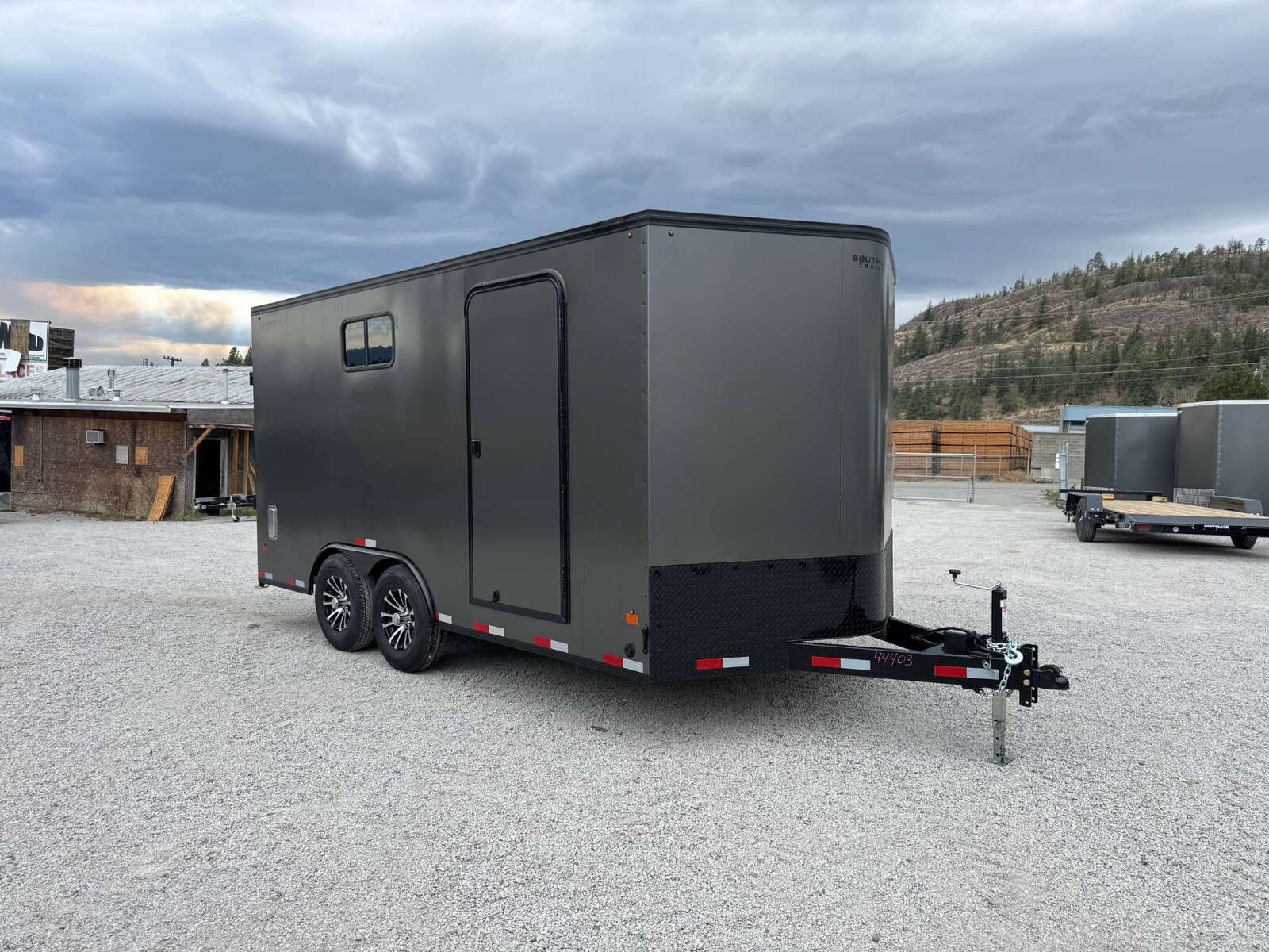 Photo of 2026 Royal 8.5x16 V Nose Cargo Enclosed Trailer Camping Package Charcoal Grey w/ Blackout Pkg, Insulated, Ramp Door, White Walls, 2x Windows & More!