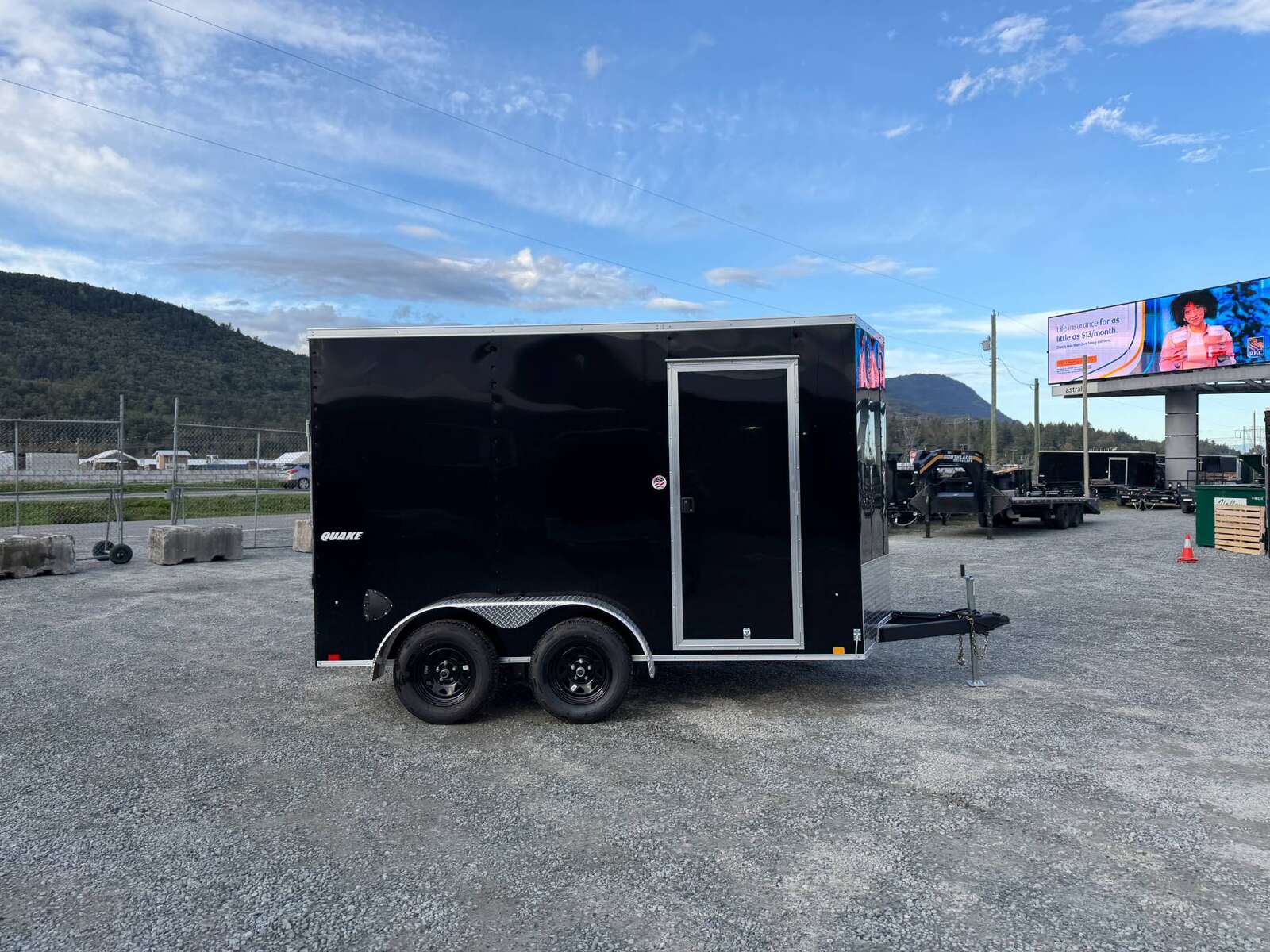 Photo of 2026 Impact Quake 7x12 Cargo Enclosed Trailer Tandem Axle 7000lb GVW Black Extra Height w/ Ramp Door