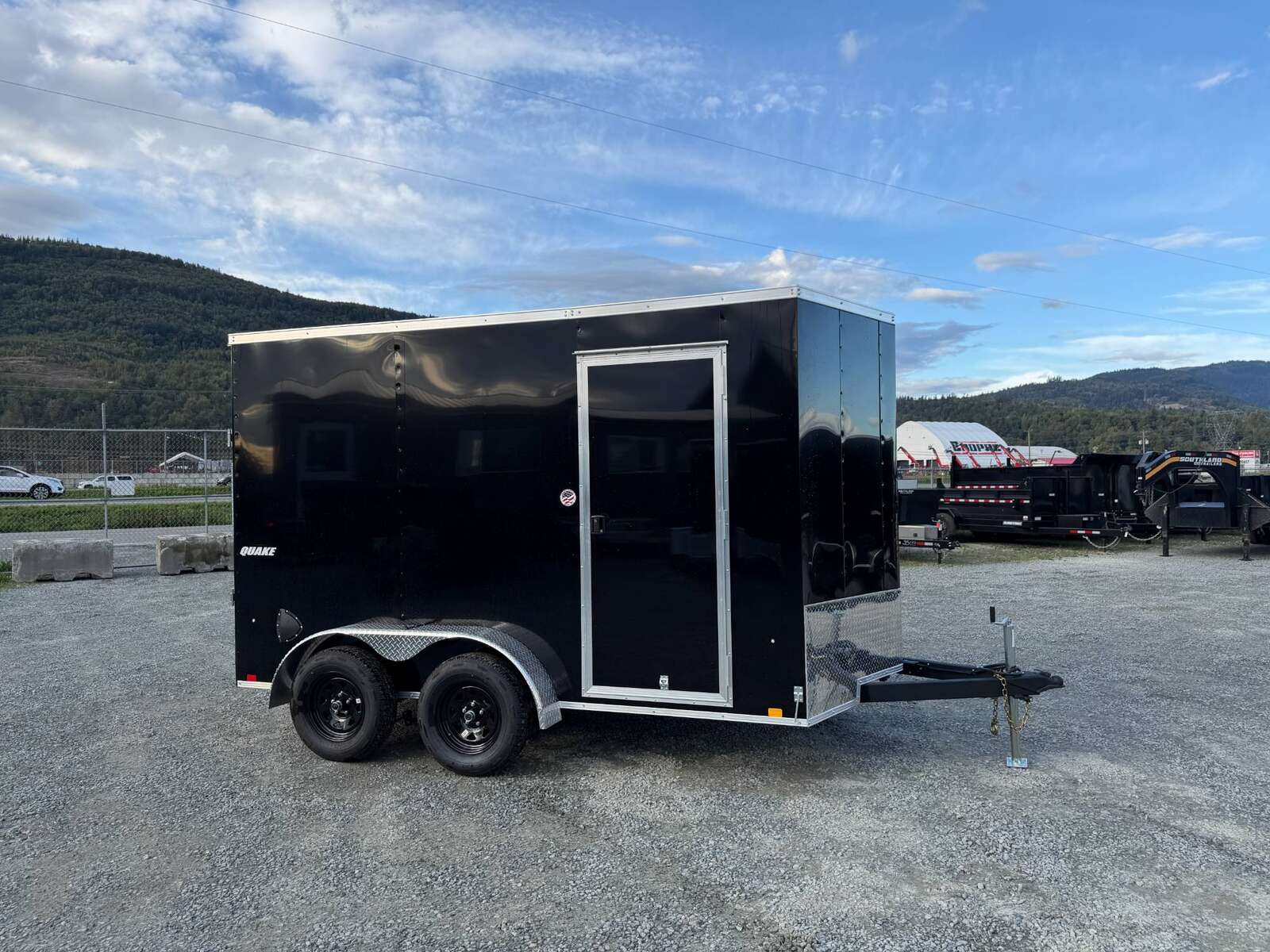 Photo of 2026 Impact Quake 7x12 Cargo Enclosed Trailer Tandem Axle 7000lb GVW Black Extra Height w/ Ramp Door