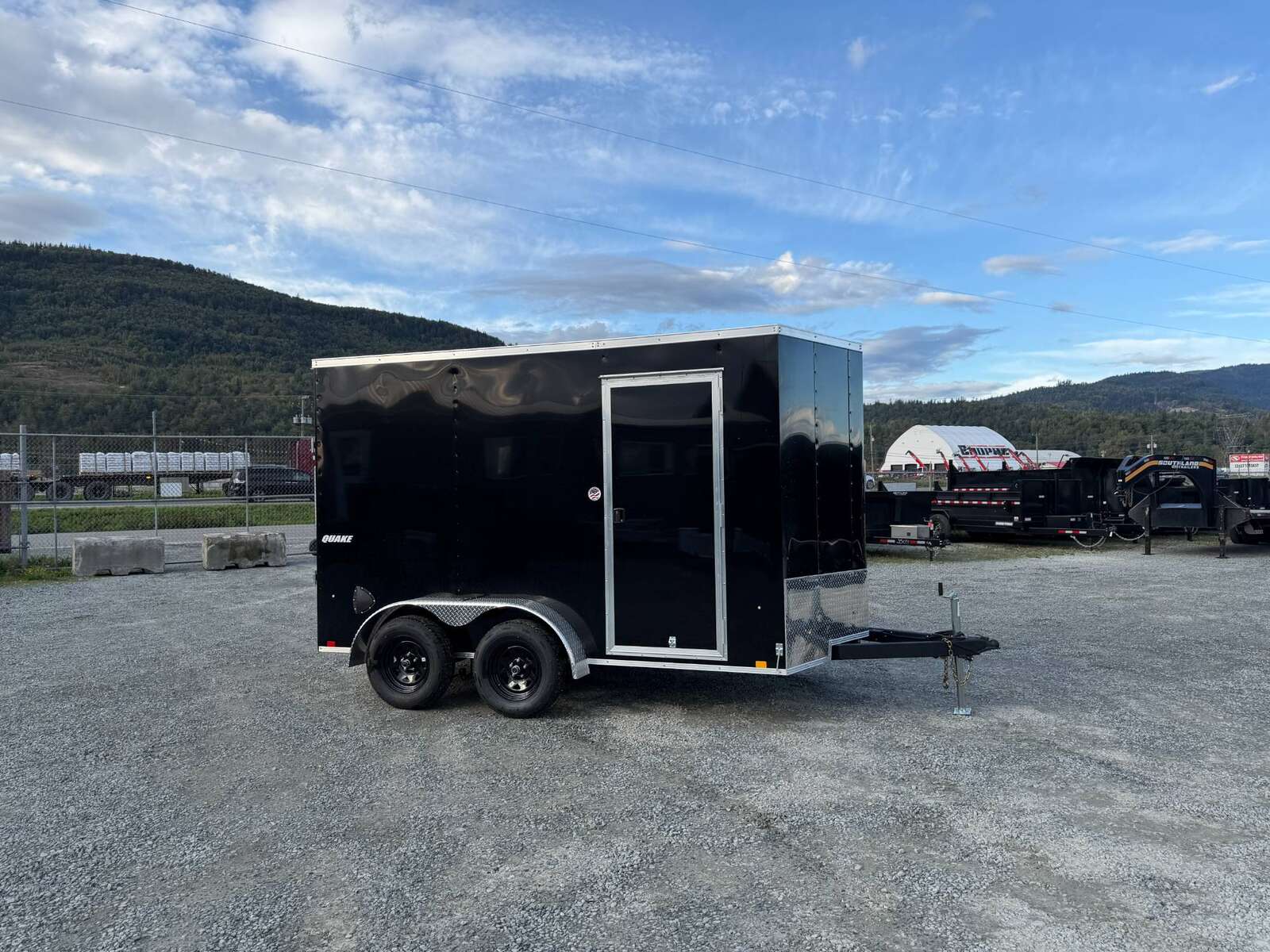Photo of 2026 Impact Quake 7x12 Cargo Enclosed Trailer Tandem Axle 7000lb GVW Black Extra Height w/ Ramp Door