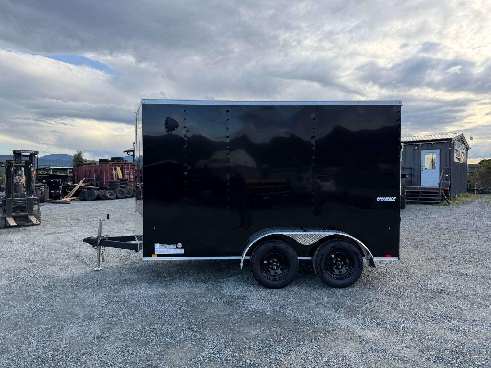 Photo of 2026 Impact Quake 7x12 Cargo Enclosed Trailer Tandem Axle 7000lb GVW Black Extra Height w/ Ramp Door