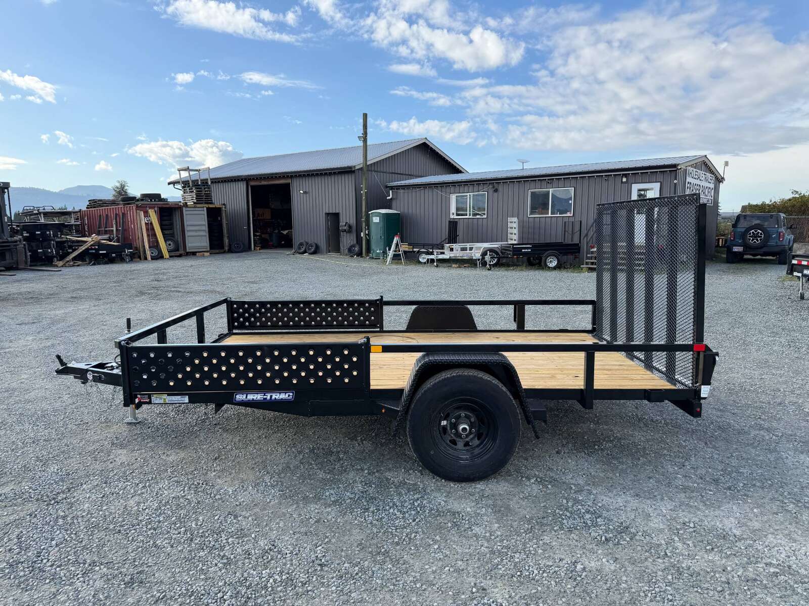 Photo of 2026 Suretrac 7x12 ATV Tube Top Utility Trailer 5000lb GVW w/ Electric Brakes & Rear Ramp Gate & Side Load Ramps
