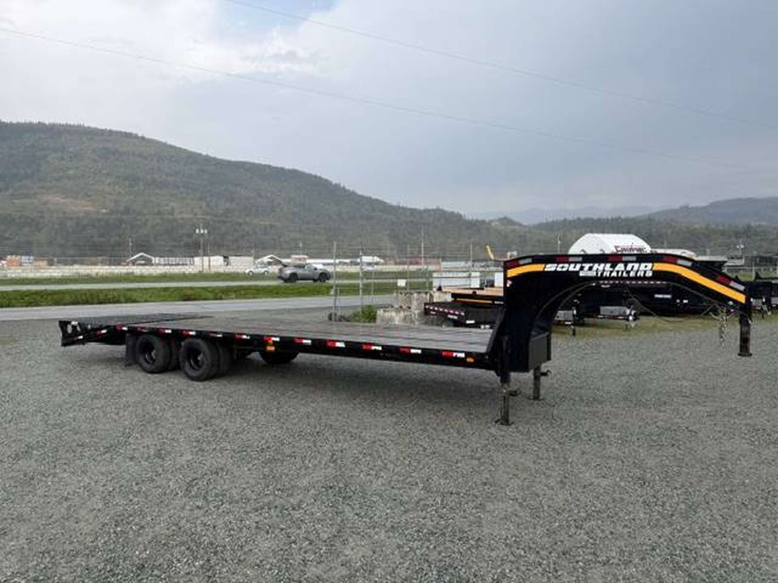 Photo of Pre Owned Used 2024 Southland 24+6 Gooseneck Flat Deck Equipment Trailer 29000lb GVW w/ Ramps 