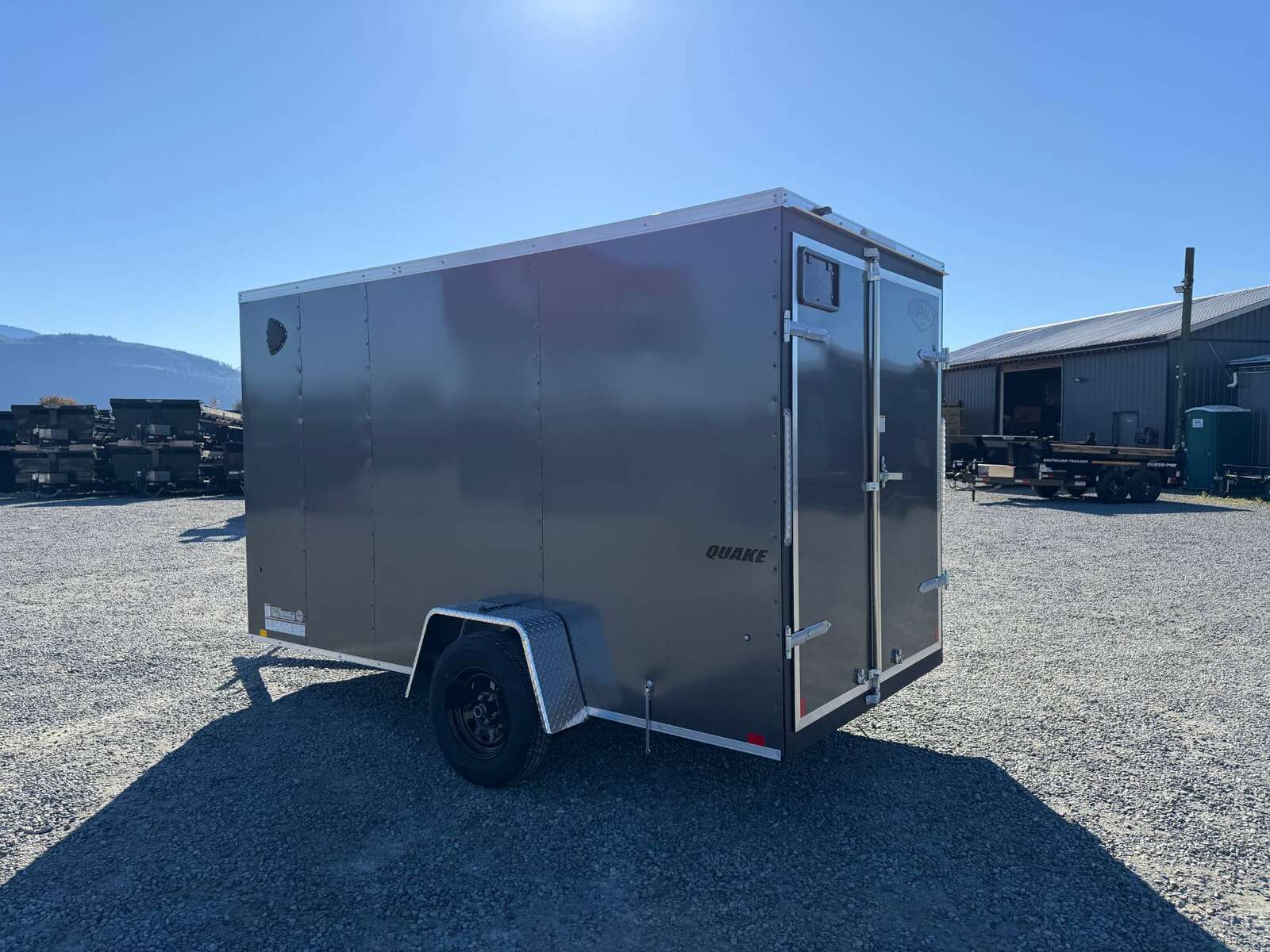 Photo of 2026 Impact Quake 6x12 V Nose Cargo / Enclosed Trailer Charcoal Grey Barn Doors Extra Height 2990lb GVW