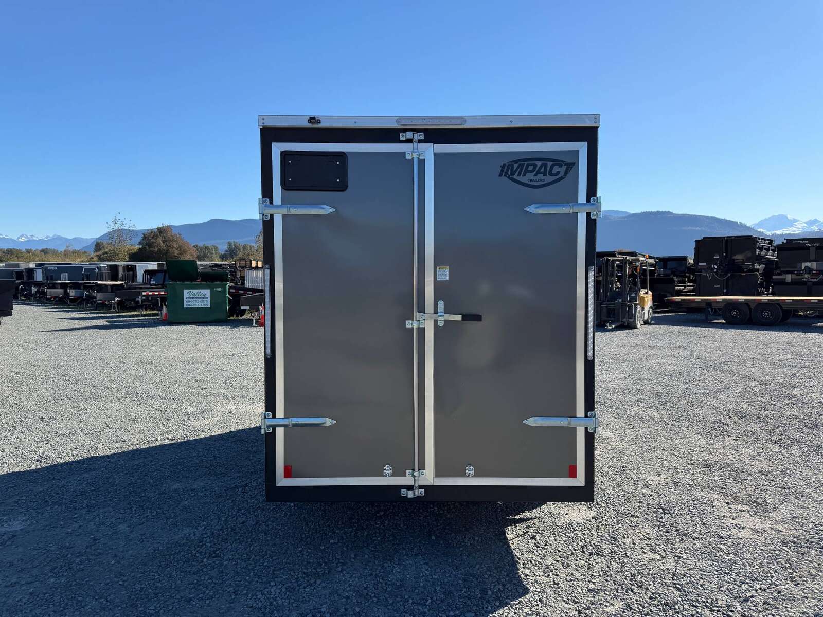 Photo of 2026 Impact Quake 6x12 V Nose Cargo / Enclosed Trailer Charcoal Grey Barn Doors Extra Height 2990lb GVW