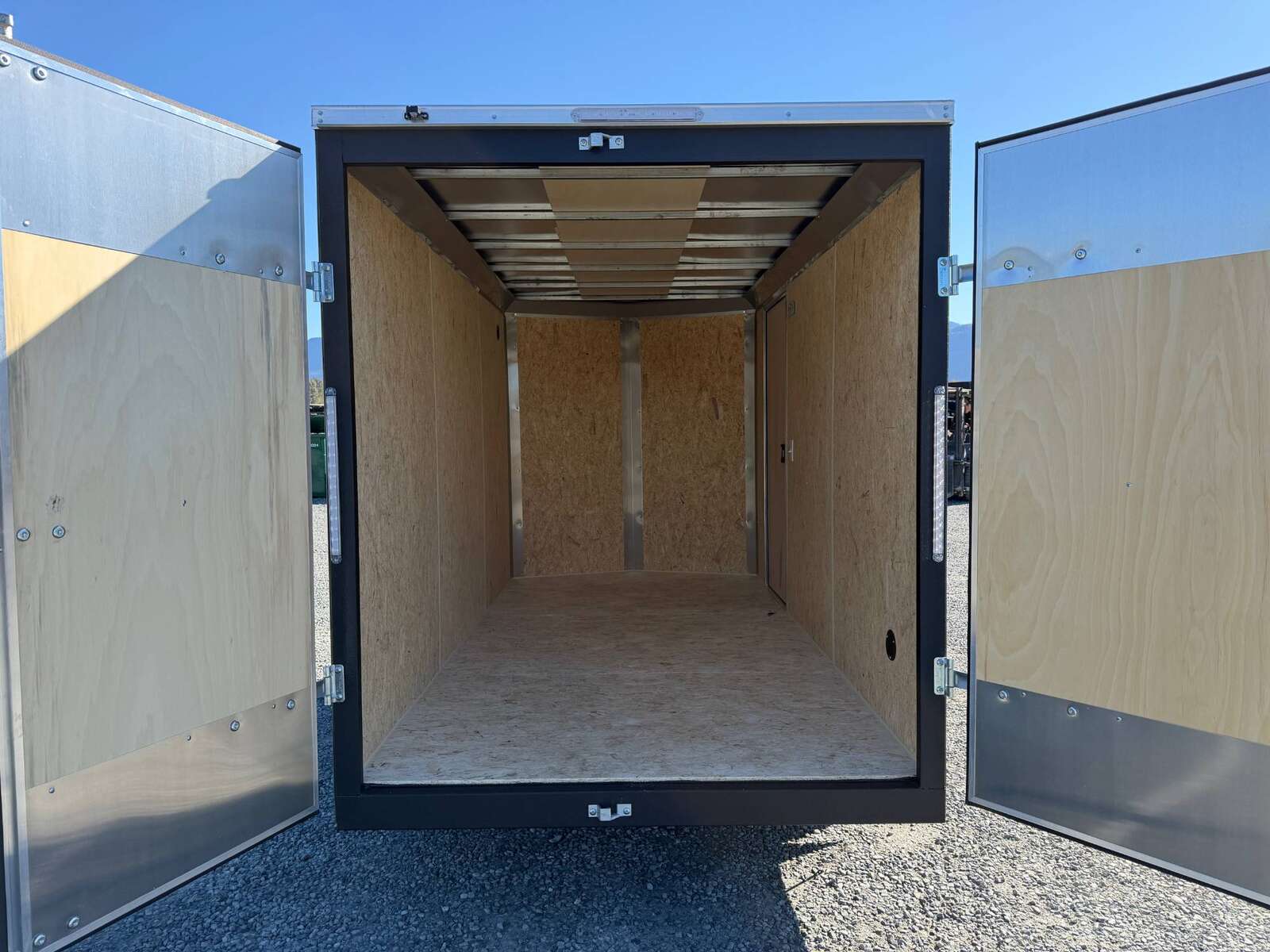 Photo of 2026 Impact Quake 6x12 V Nose Cargo / Enclosed Trailer Charcoal Grey Barn Doors Extra Height 2990lb GVW