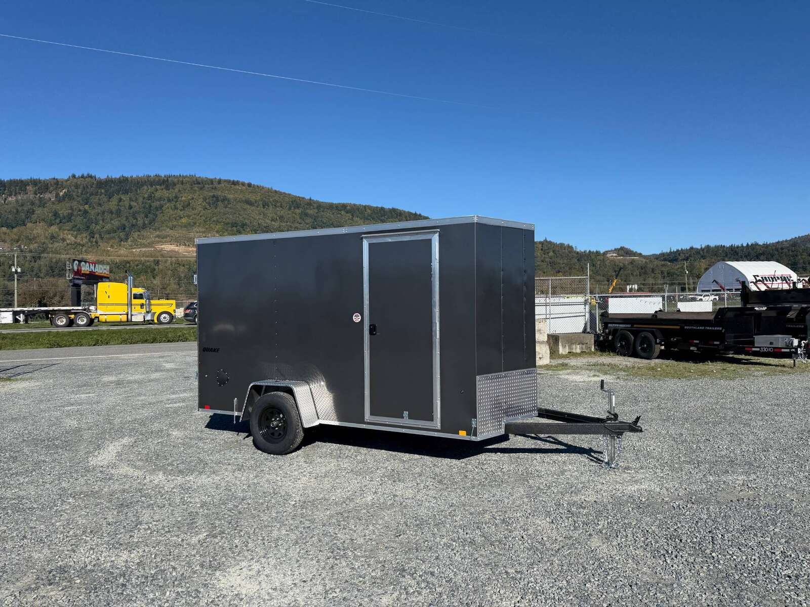 Photo of 2026 Impact Quake 6x12 V Nose Cargo / Enclosed Trailer Charcoal Grey Barn Doors Extra Height 2990lb GVW