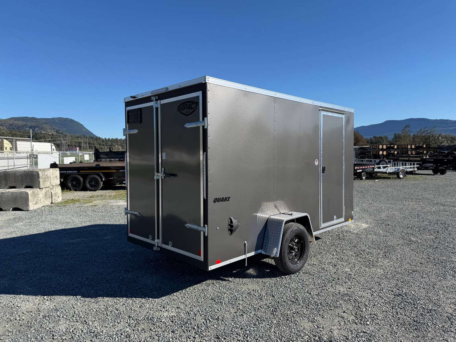 Photo of 2026 Impact Quake 6x12 V Nose Cargo / Enclosed Trailer Charcoal Grey Barn Doors Extra Height 2990lb GVW