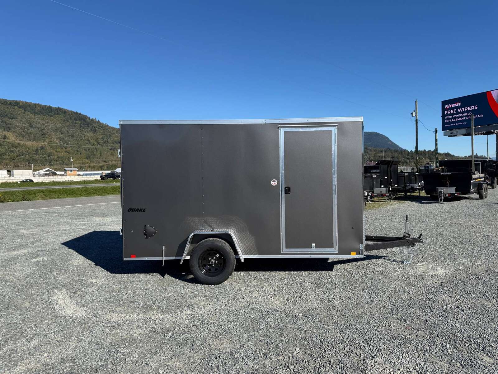 Photo of 2026 Impact Quake 6x12 V Nose Cargo / Enclosed Trailer Charcoal Grey Barn Doors Extra Height 2990lb GVW