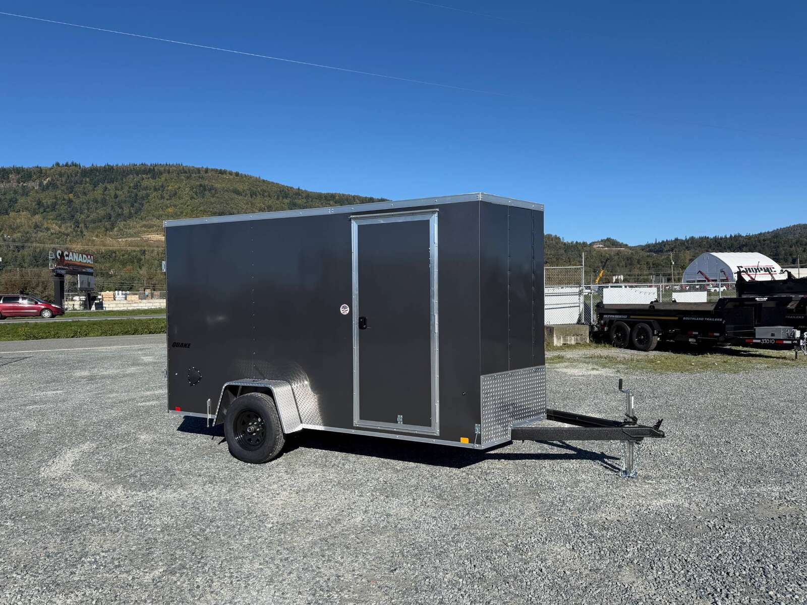 Photo of 2026 Impact Quake 6x12 V Nose Cargo / Enclosed Trailer Charcoal Grey Barn Doors Extra Height 2990lb GVW