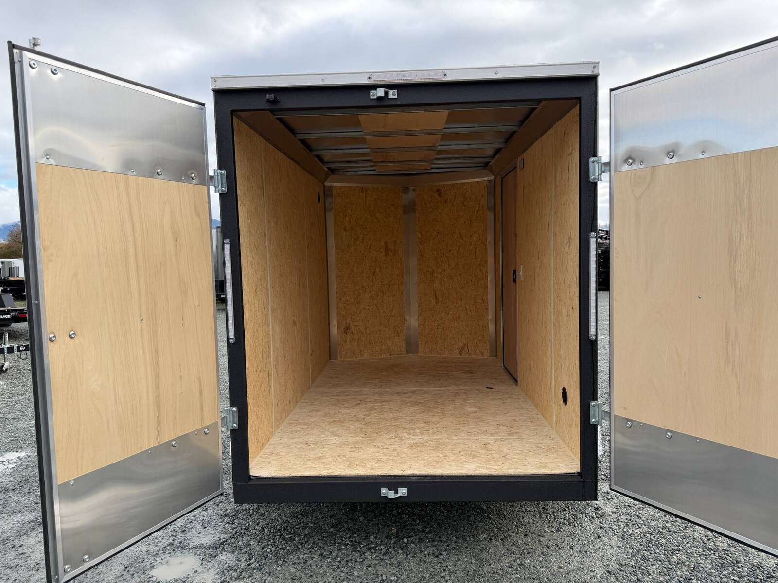 Photo of 2026 Impact Quake 6x10 V Nose Cargo / Enclosed Trailer Charcoal Grey Barn Doors Extra Height 2990lb GVW