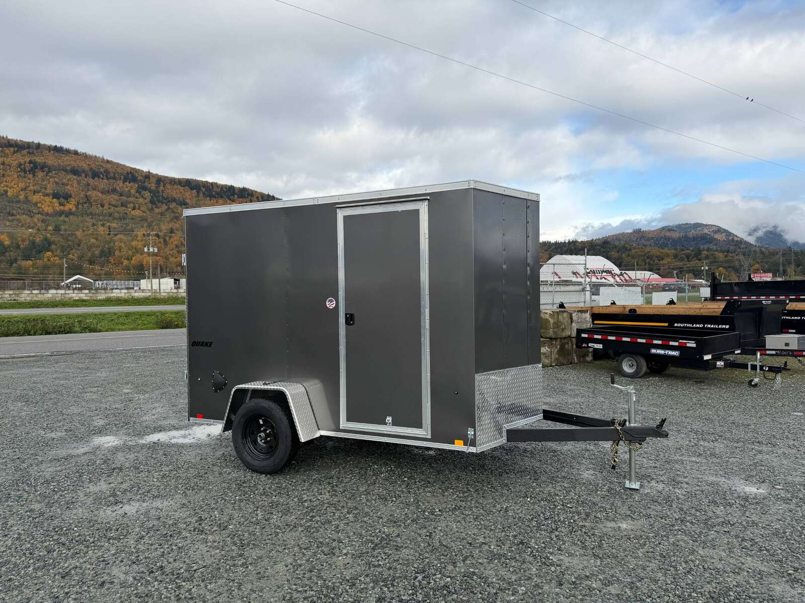 Photo of 2026 Impact Quake 6x10 V Nose Cargo / Enclosed Trailer Charcoal Grey Barn Doors Extra Height 2990lb GVW