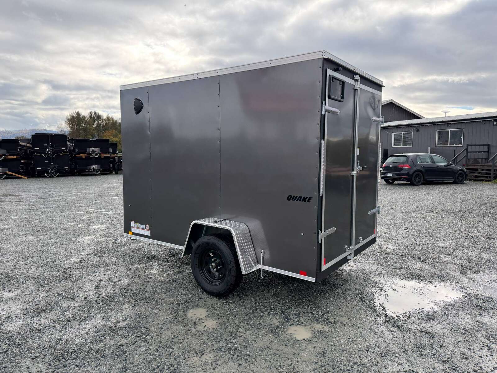 Photo of 2026 Impact Quake 6x10 V Nose Cargo / Enclosed Trailer Charcoal Grey Barn Doors Extra Height 2990lb GVW
