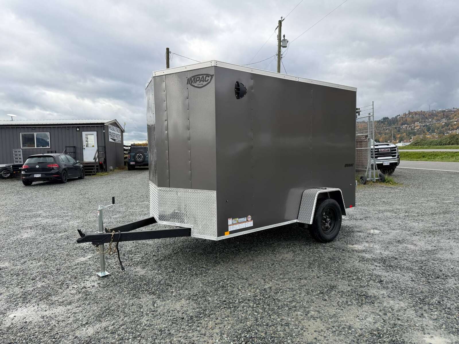 Photo of 2026 Impact Quake 6x10 V Nose Cargo / Enclosed Trailer Charcoal Grey Barn Doors Extra Height 2990lb GVW