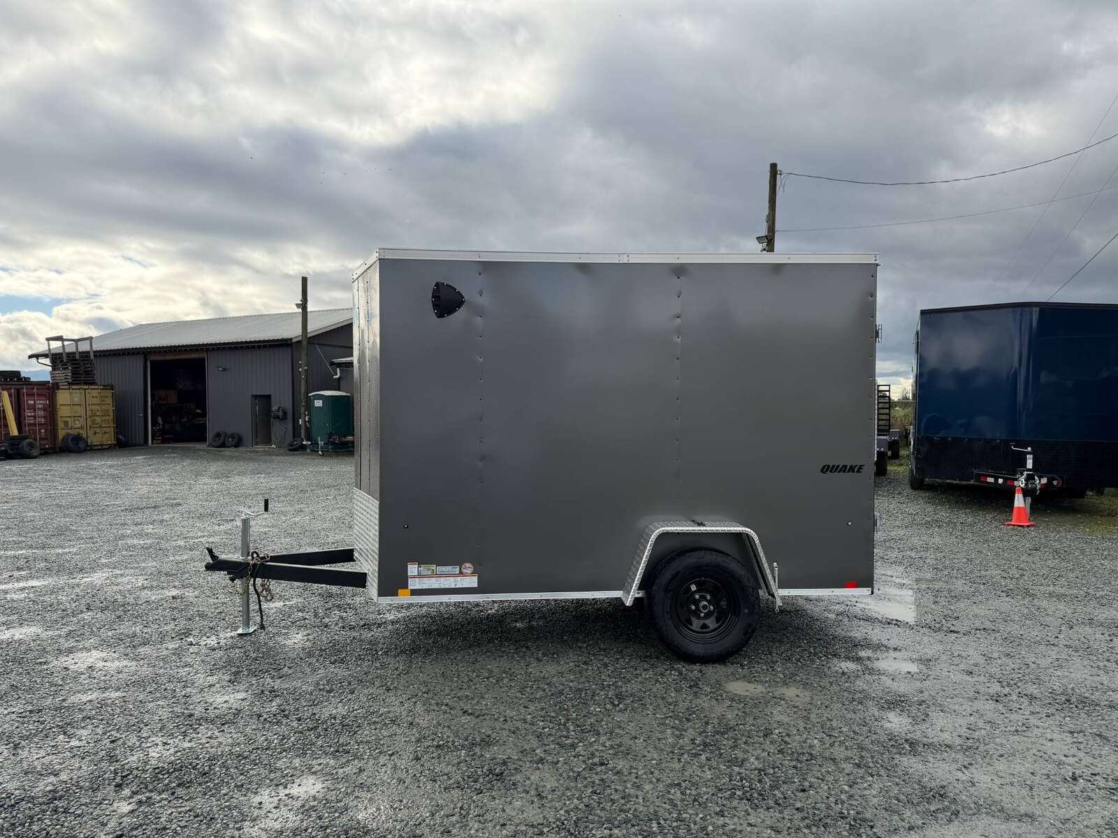 Photo of 2026 Impact Quake 6x10 V Nose Cargo / Enclosed Trailer Charcoal Grey Barn Doors Extra Height 2990lb GVW