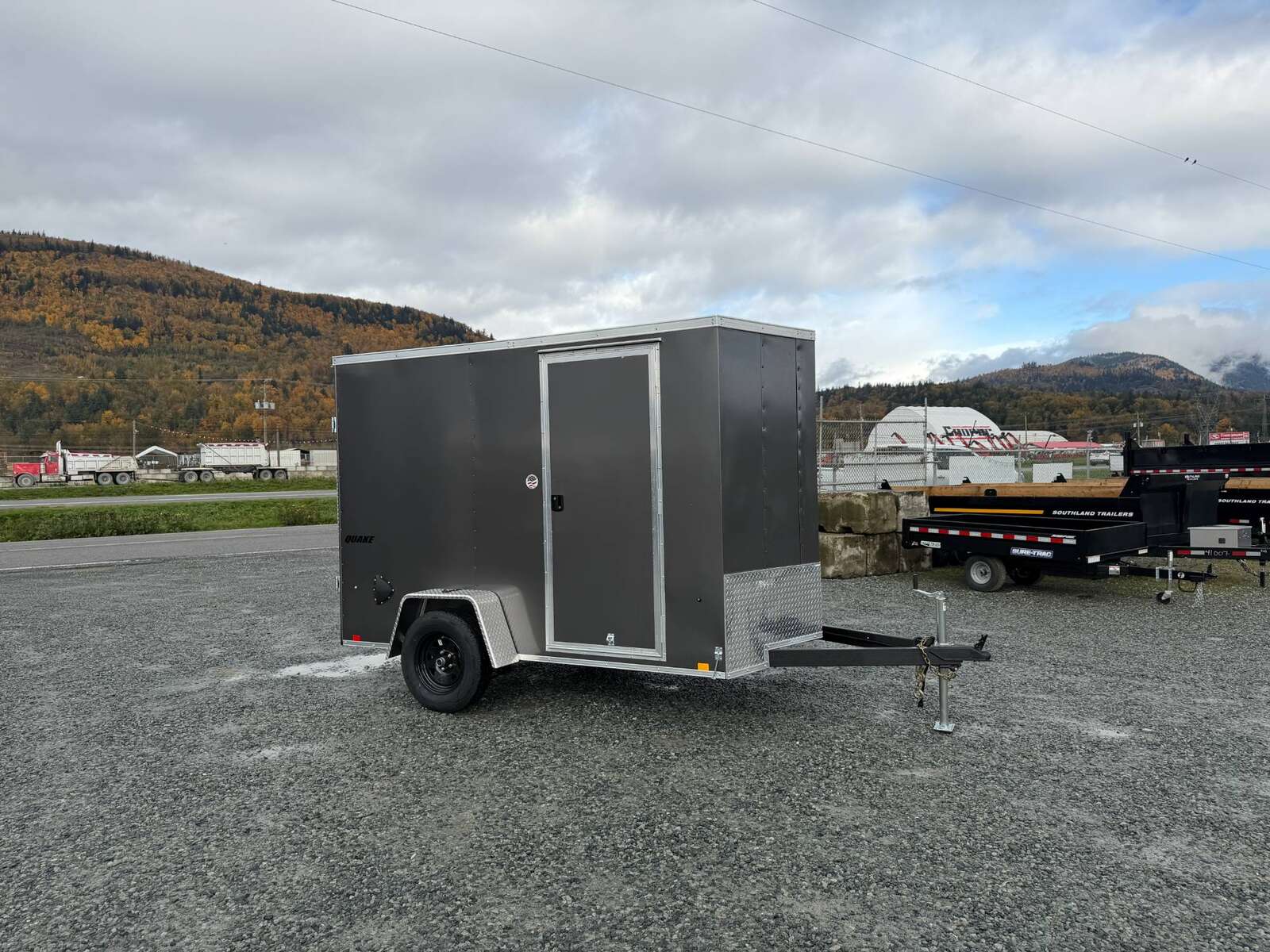 Photo of 2026 Impact Quake 6x10 V Nose Cargo / Enclosed Trailer Charcoal Grey Barn Doors Extra Height 2990lb GVW