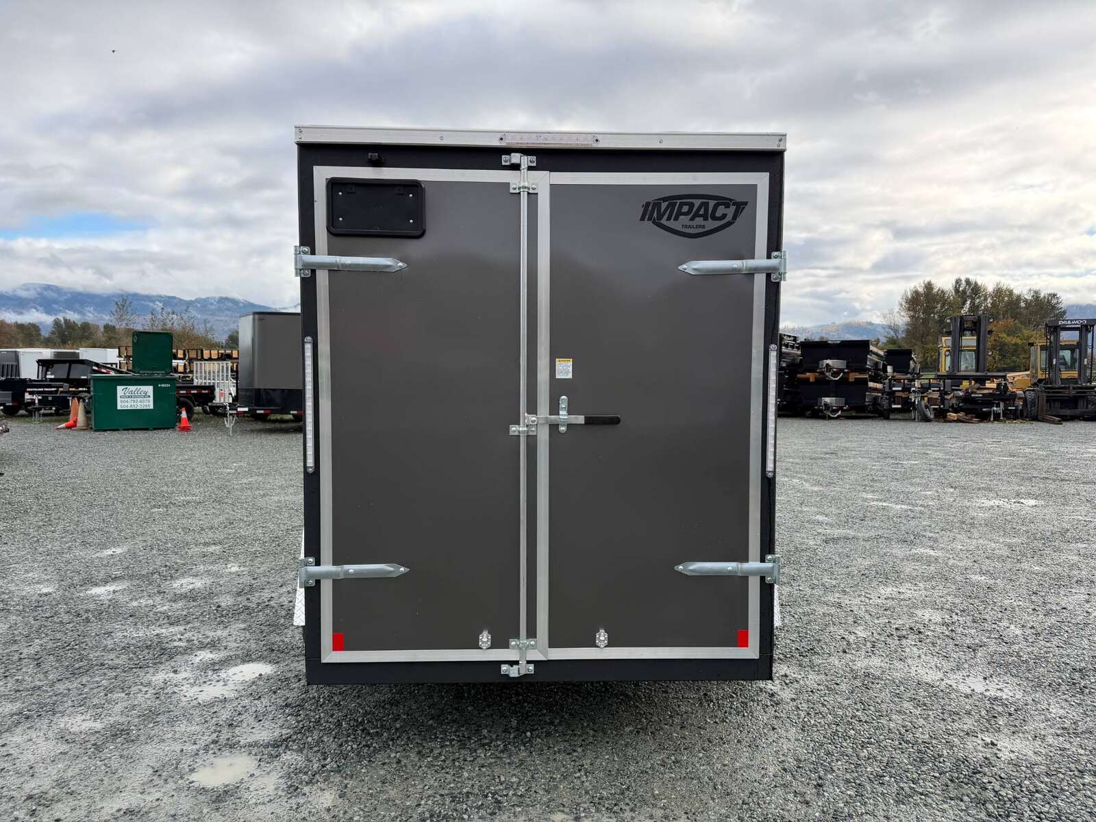 Photo of 2026 Impact Quake 6x10 V Nose Cargo / Enclosed Trailer Charcoal Grey Barn Doors Extra Height 2990lb GVW