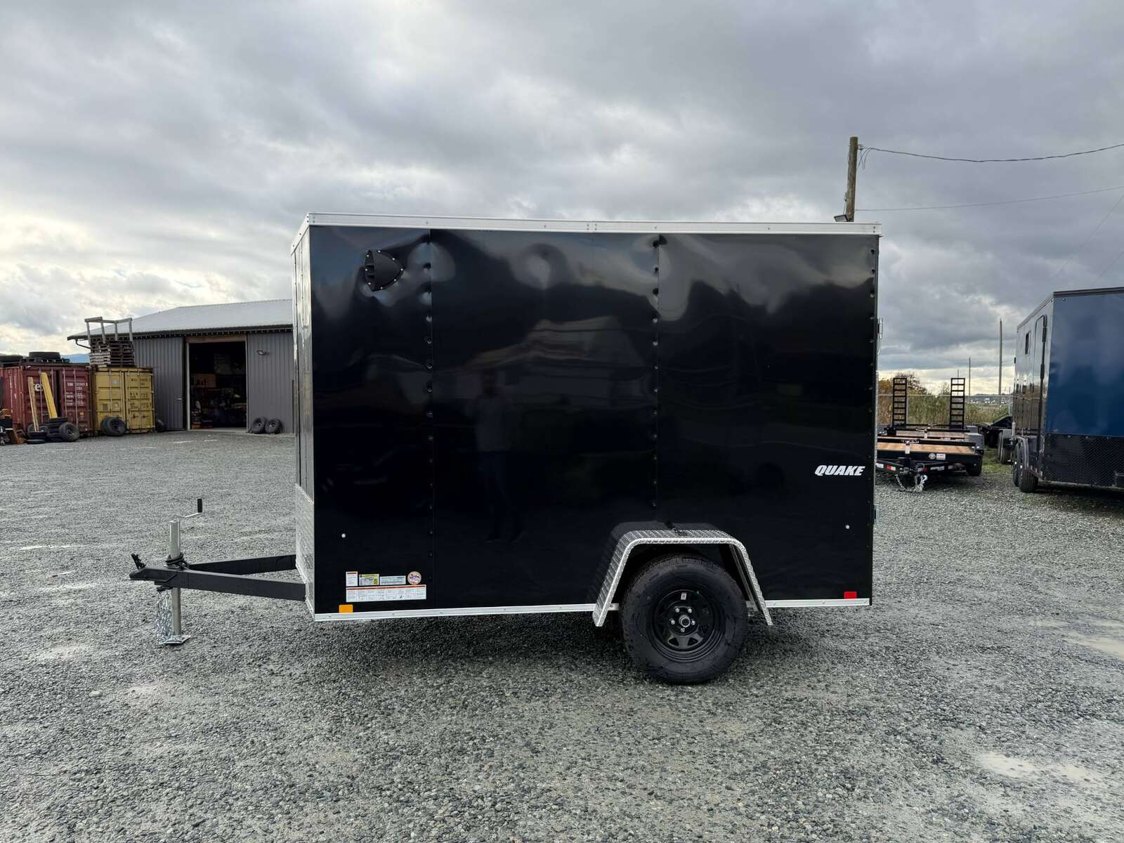 Photo of 2026 Impact Quake 6x10 V Nose Cargo / Enclosed Trailer Black Ramp Door Extra Height 2990lb GVW