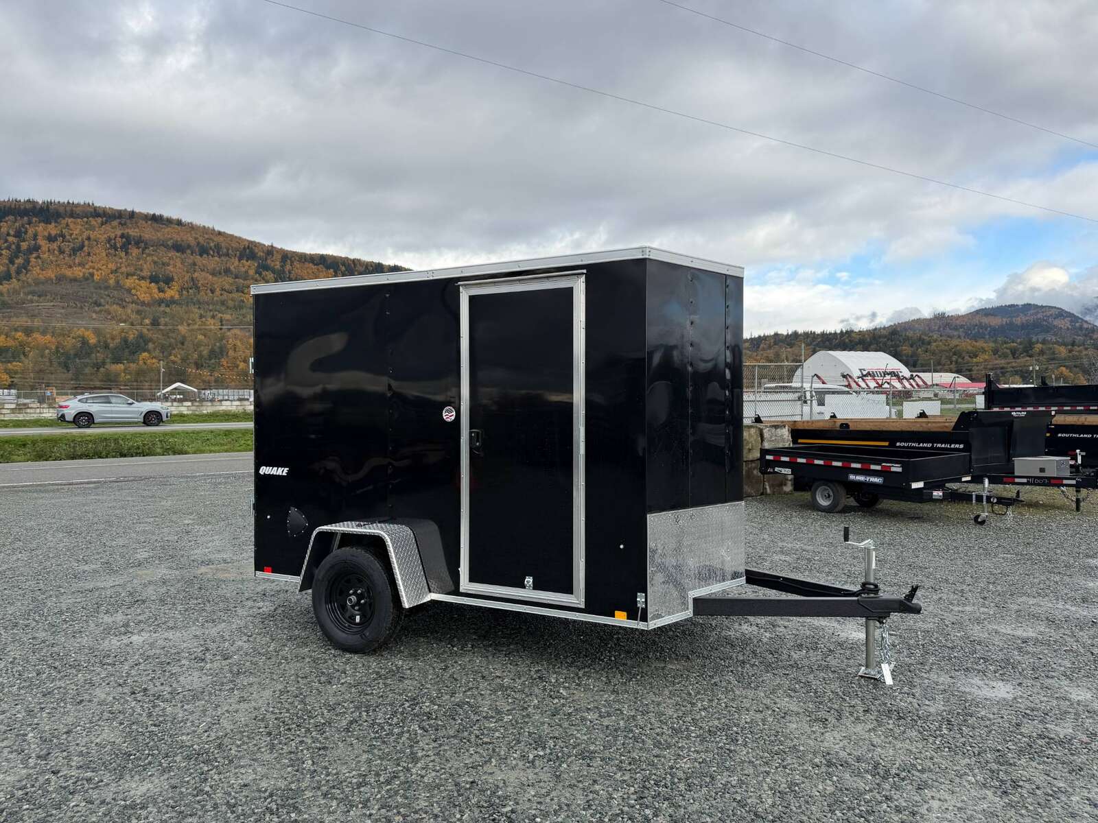 Photo of 2026 Impact Quake 6x10 V Nose Cargo / Enclosed Trailer Black Ramp Door Extra Height 2990lb GVW