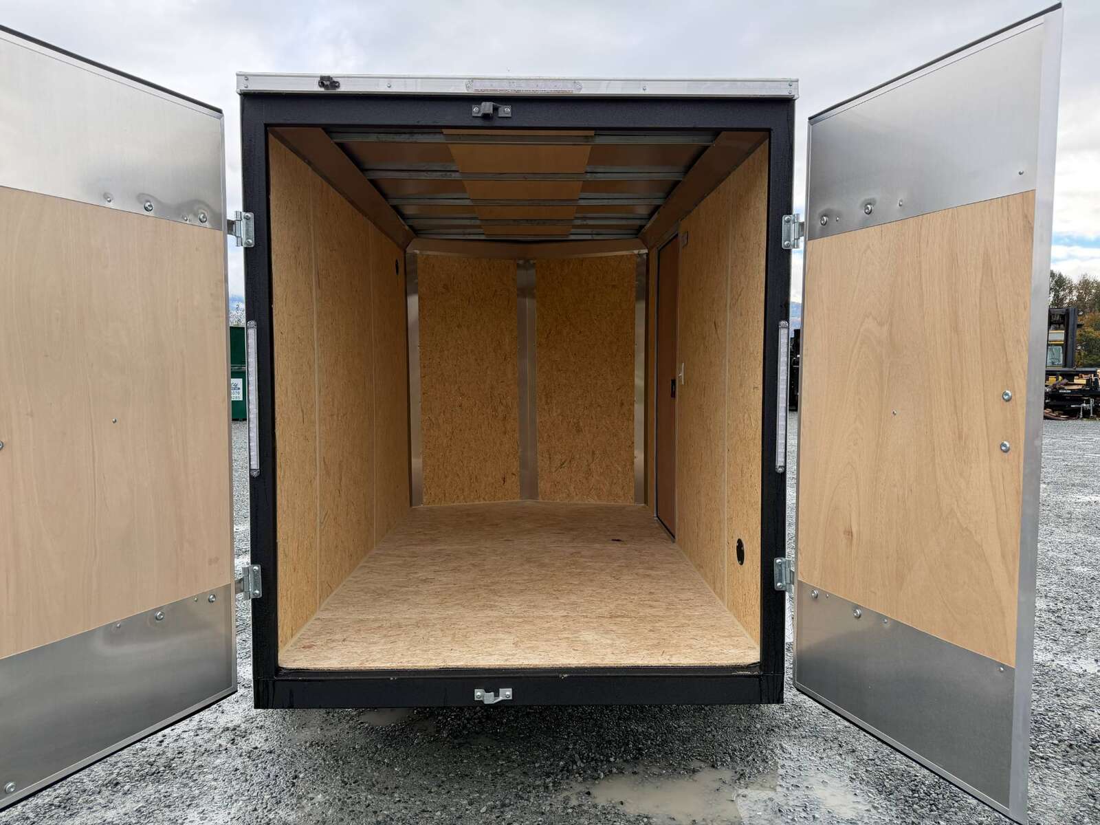 Photo of 2026 Impact Quake 6x10 V Nose Cargo / Enclosed Trailer White Barn Doors Extra Height 2990lb GVW