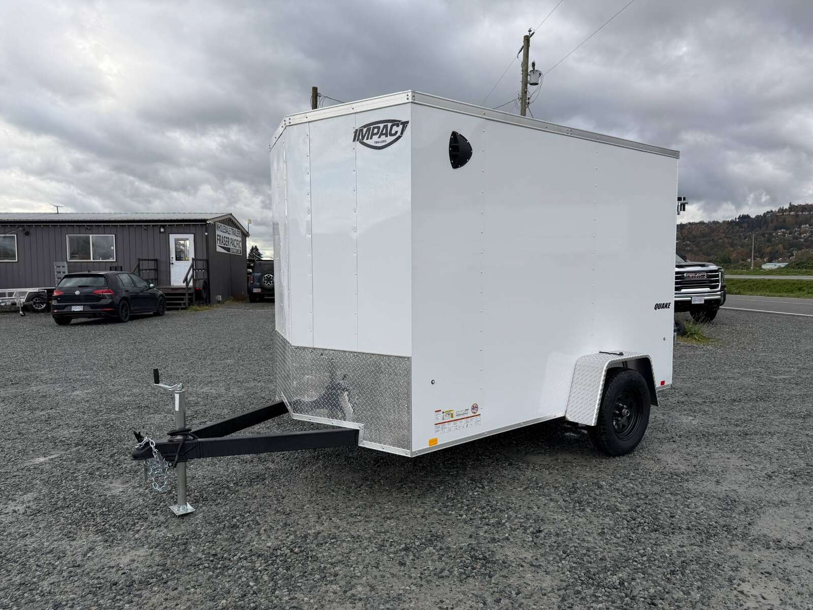 Photo of 2026 Impact Quake 6x10 V Nose Cargo / Enclosed Trailer White Barn Doors Extra Height 2990lb GVW