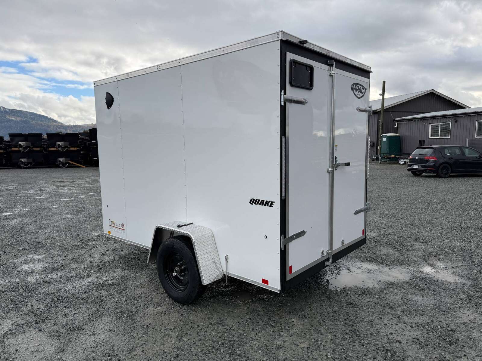 Photo of 2026 Impact Quake 6x10 V Nose Cargo / Enclosed Trailer White Barn Doors Extra Height 2990lb GVW