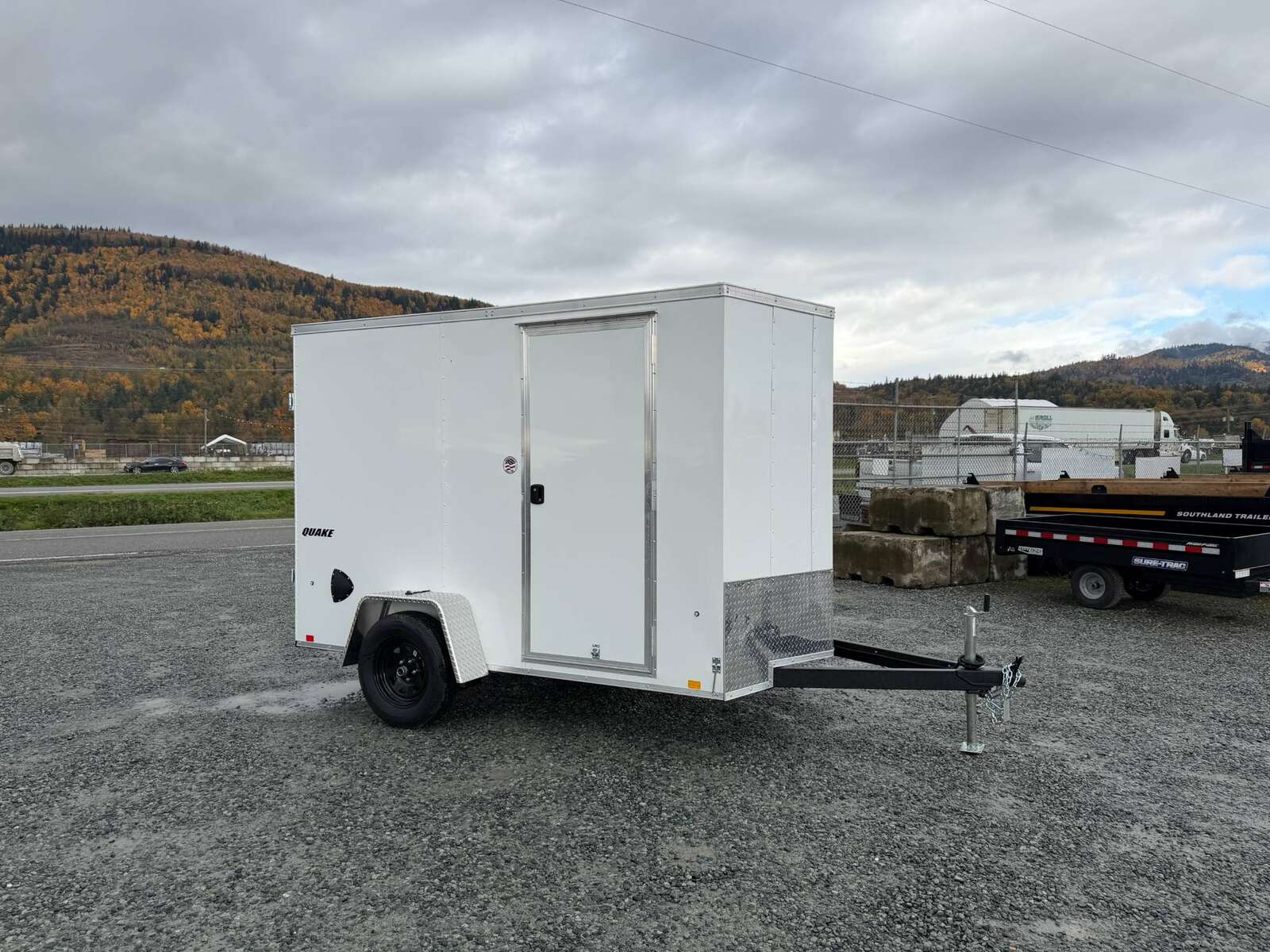 Photo of 2026 Impact Quake 6x10 V Nose Cargo / Enclosed Trailer White Barn Doors Extra Height 2990lb GVW