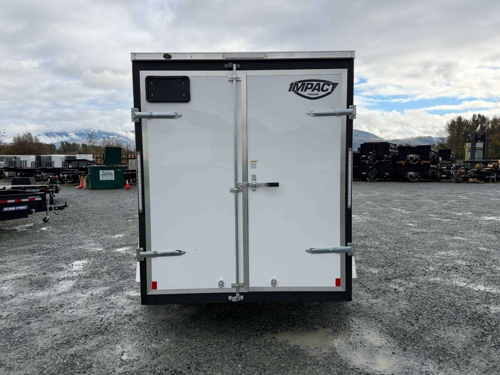 Photo of 2026 Impact Quake 6x10 V Nose Cargo / Enclosed Trailer White Barn Doors Extra Height 2990lb GVW