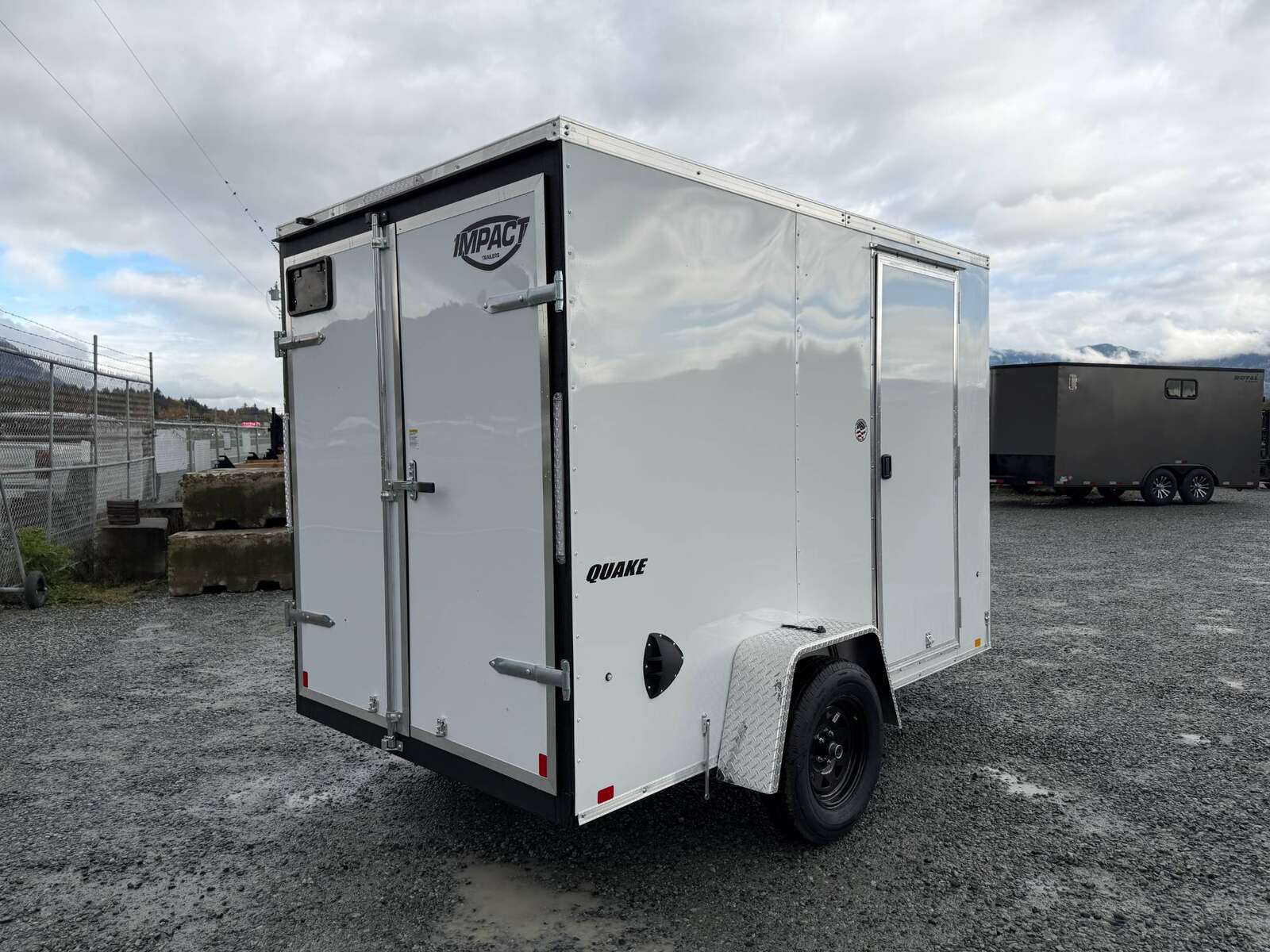 Photo of 2026 Impact Quake 6x10 V Nose Cargo / Enclosed Trailer White Barn Doors Extra Height 2990lb GVW