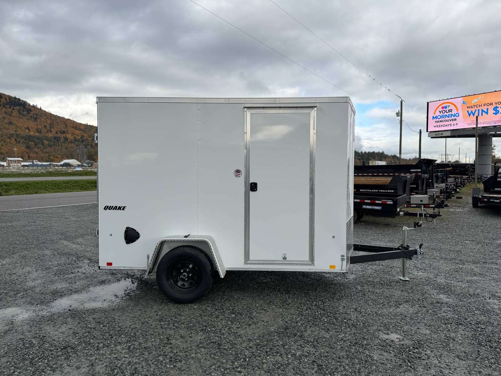 Photo of 2026 Impact Quake 6x10 V Nose Cargo / Enclosed Trailer White Barn Doors Extra Height 2990lb GVW
