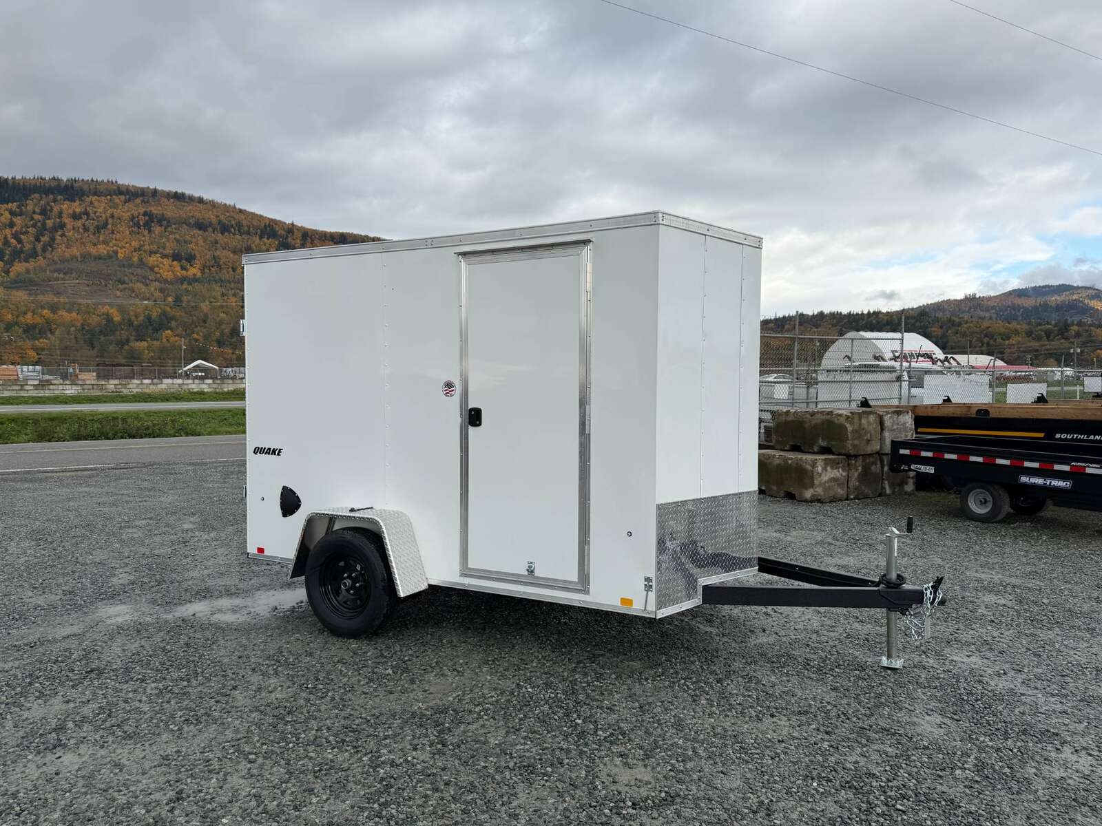 Photo of 2026 Impact Quake 6x10 V Nose Cargo / Enclosed Trailer White Barn Doors Extra Height 2990lb GVW