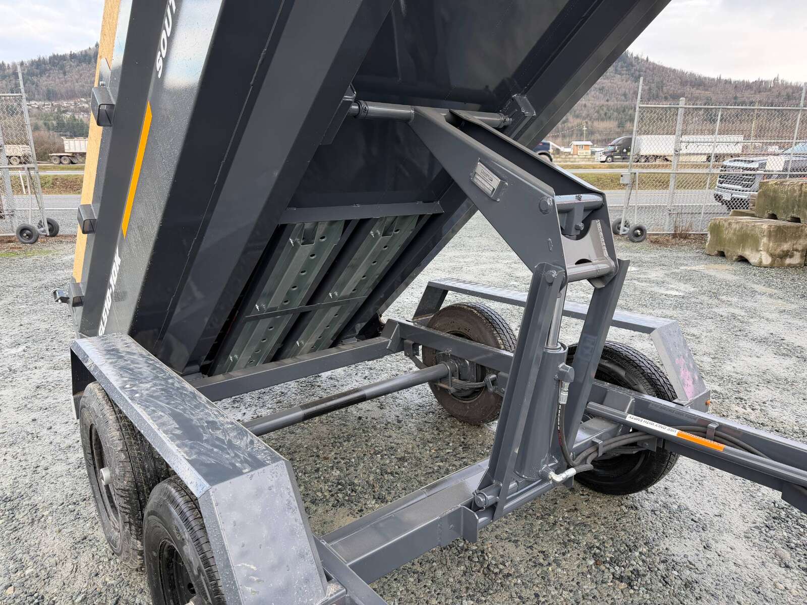 Photo of 2026 Southland 5x10 Dump Trailer 11,464lbs GVW Charcoal Grey w/ Tarp & Ramps