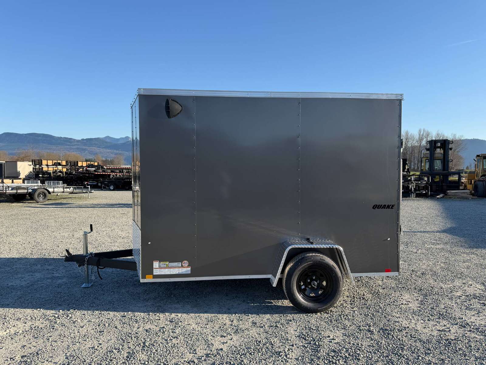 Photo of 2026 Impact Quake 6x10 V Nose Cargo / Enclosed Trailer Charcoal Grey Ramp Door Extra Height 2990lb GVW