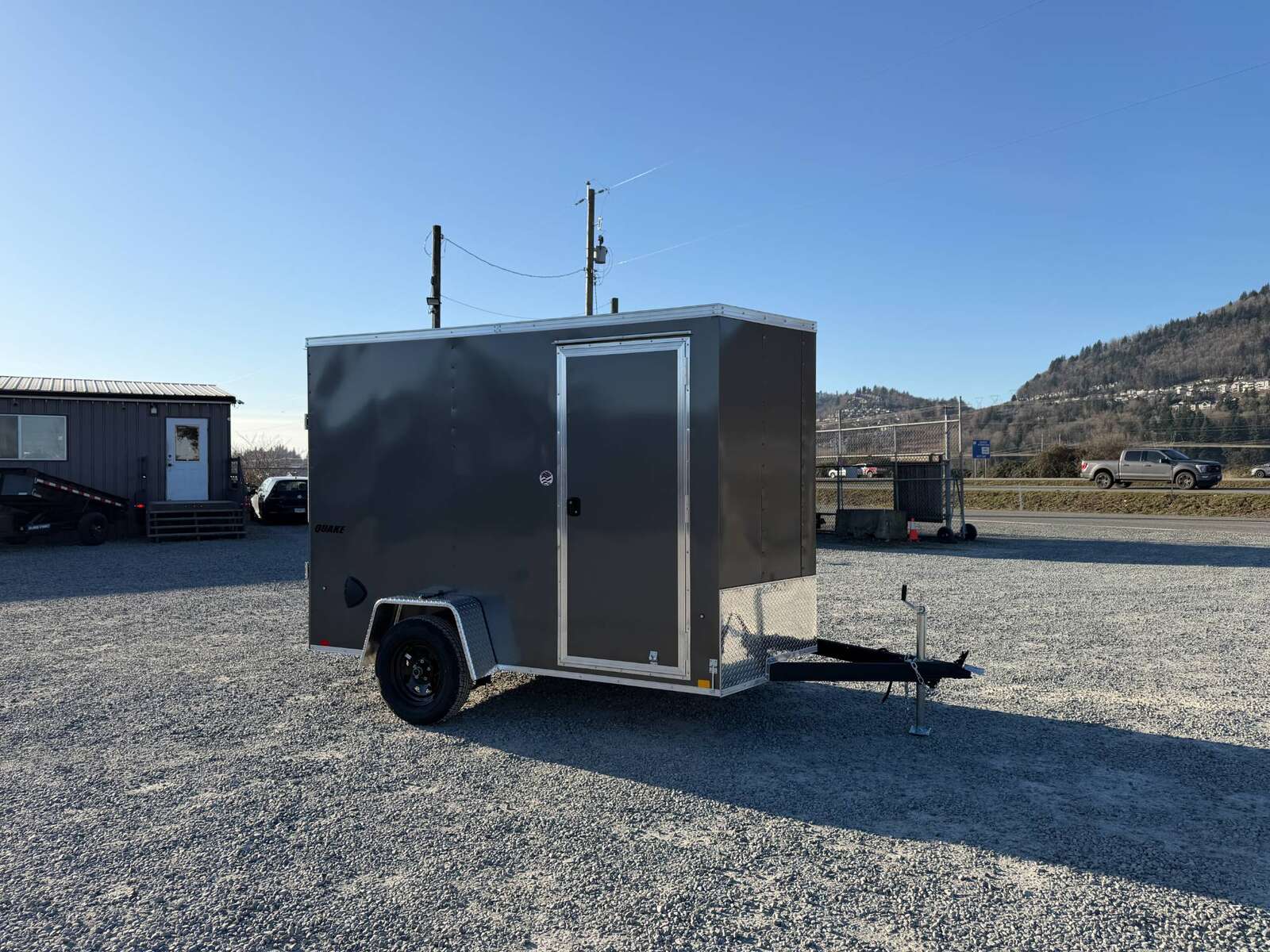 Photo of 2026 Impact Quake 6x10 V Nose Cargo / Enclosed Trailer Charcoal Grey Ramp Door Extra Height 2990lb GVW