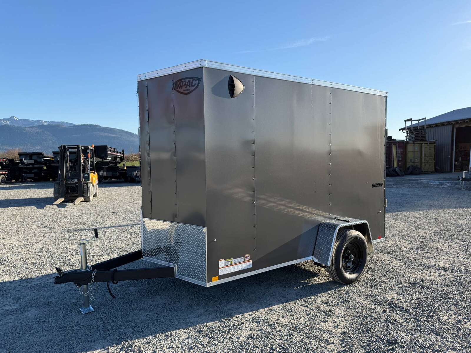 Photo of 2026 Impact Quake 6x10 V Nose Cargo / Enclosed Trailer Charcoal Grey Ramp Door Extra Height 2990lb GVW